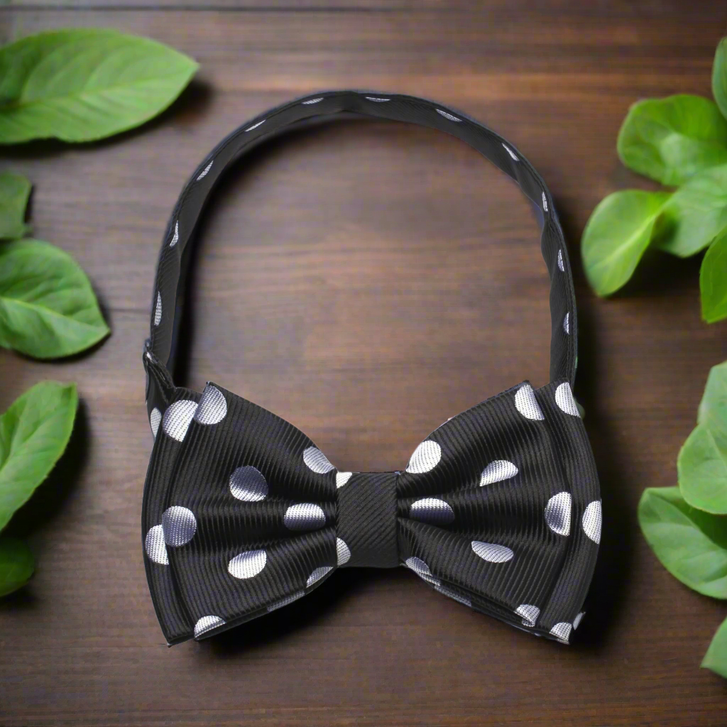 White silk polka dot bow tie styled with a black suit for a wedding