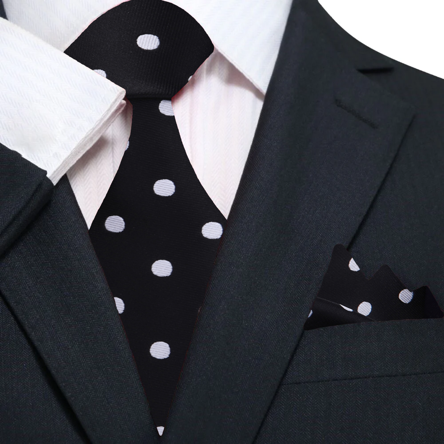 Man wearing a stylish polka dot silk tie with a navy suit at a formal event