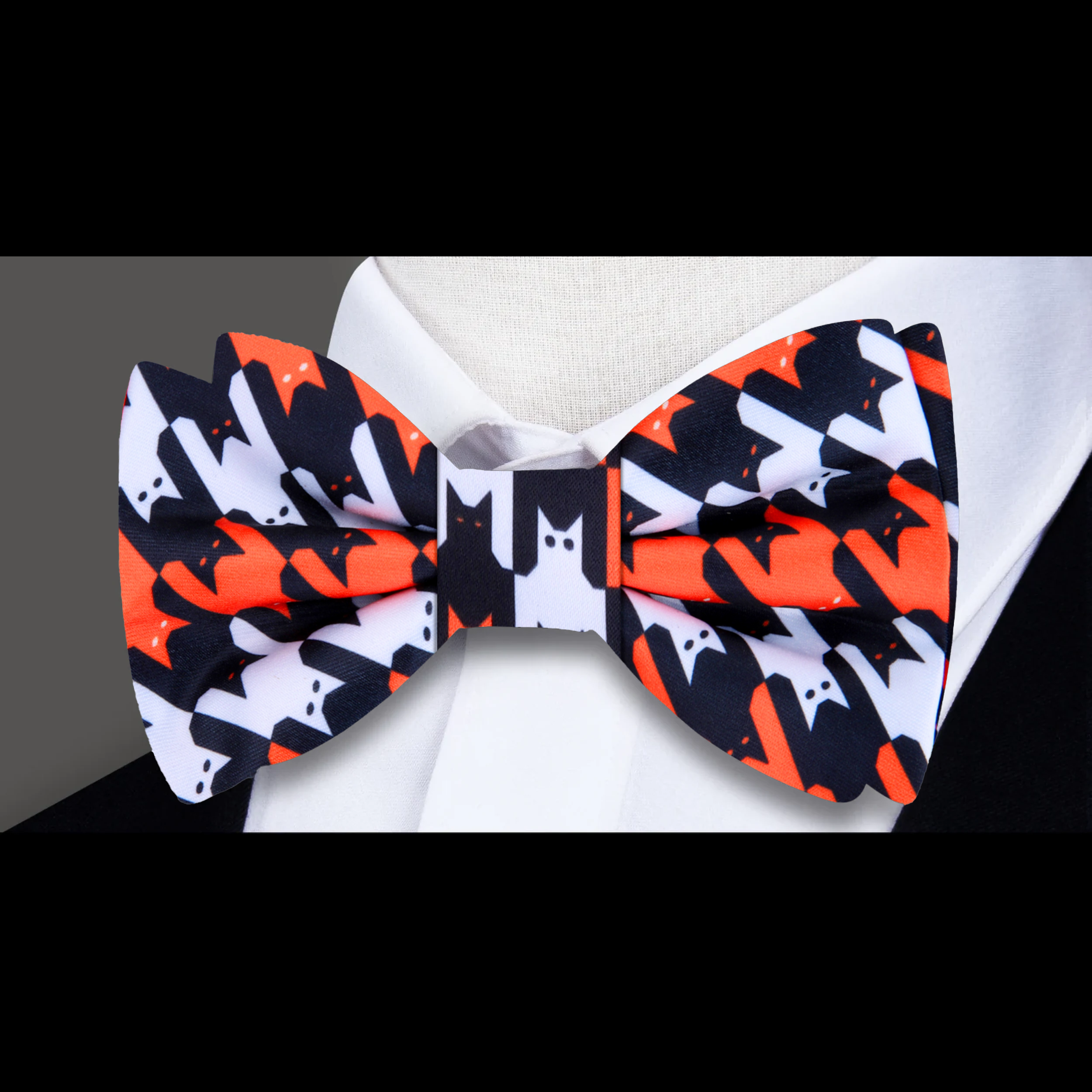 Silk bow tie styled with a gray tweed blazer for casual Halloween look