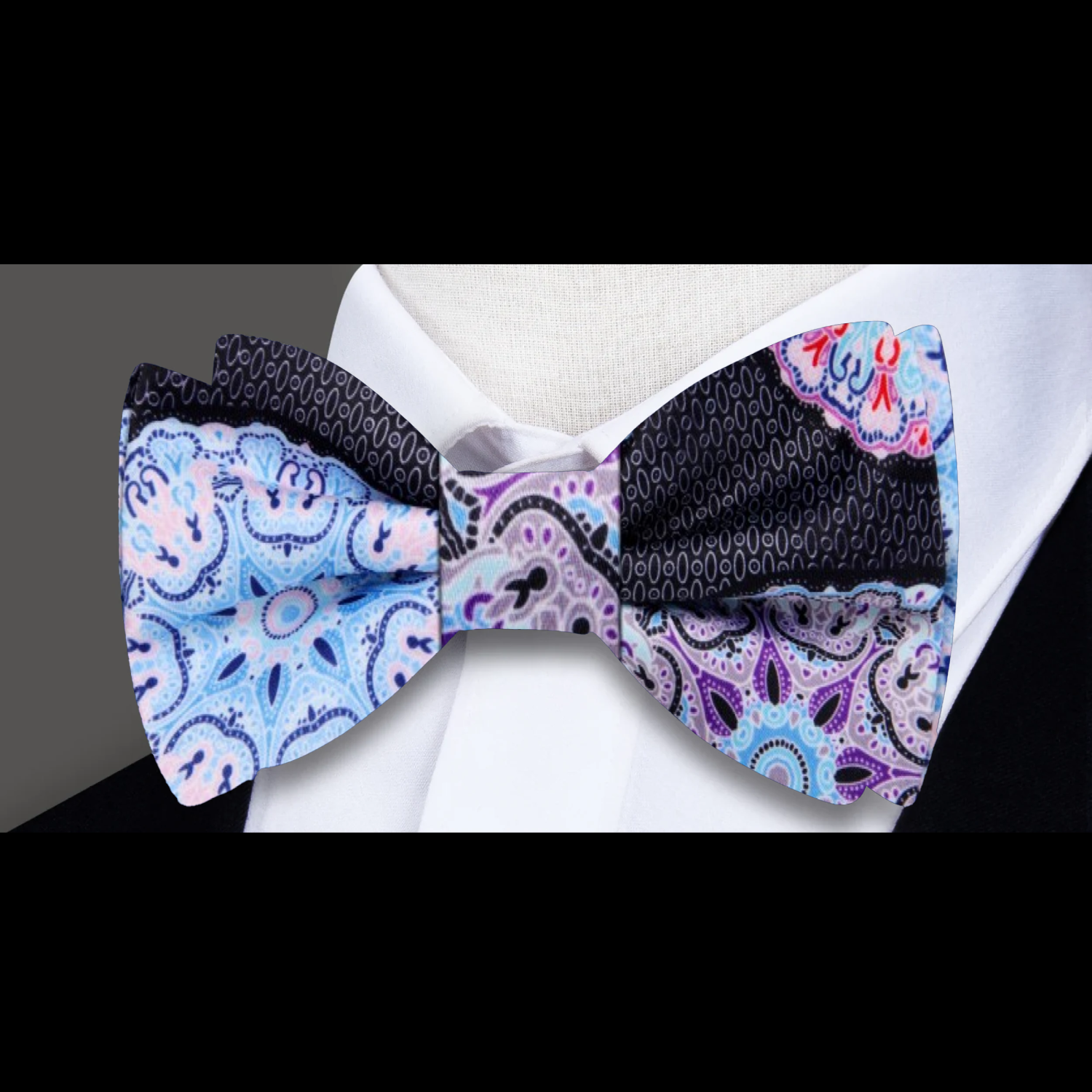 Fashion-forward man wearing a silk bow tie with kaleidoscope pattern, suited for formal occasions
