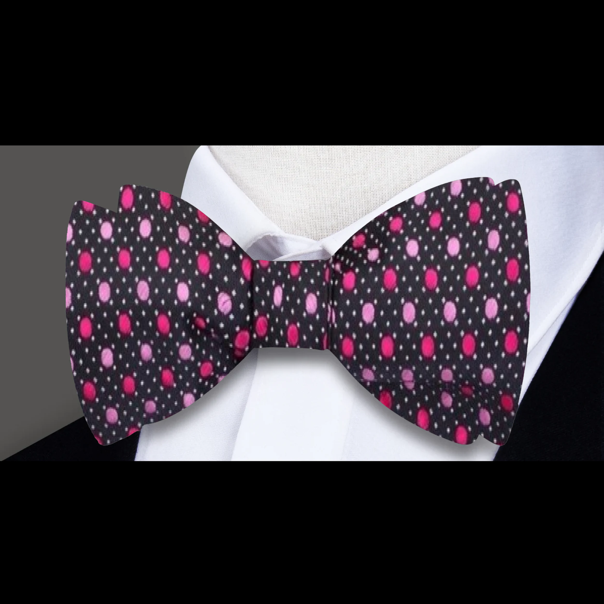 Close-up of silk bow tie with blue polka dots, styled for gala evening wear