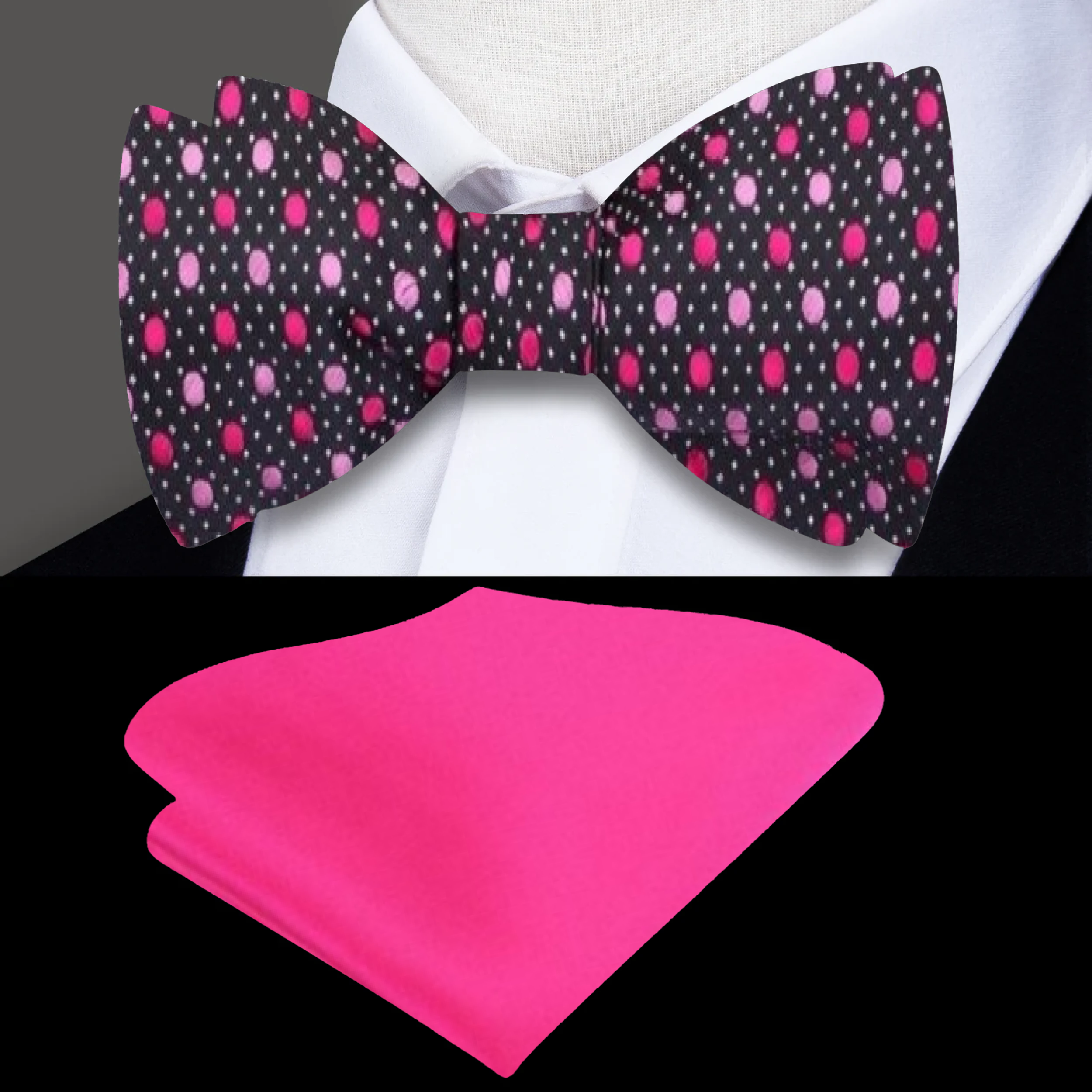 Model wearing pink polka dot silk bow tie with charcoal suit at cocktail party