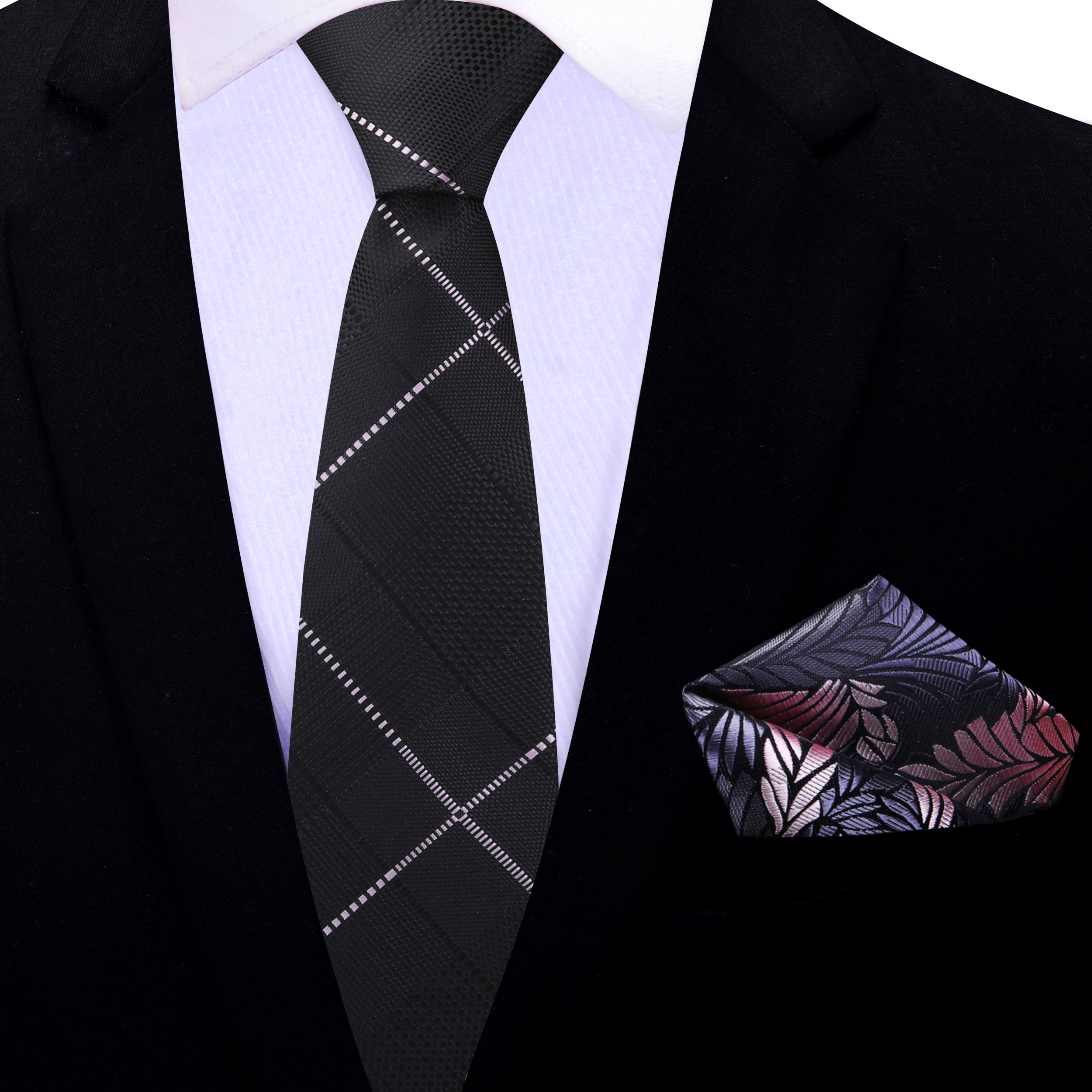 Close-up of the fabric texture of the black plaid necktie with pink accents.