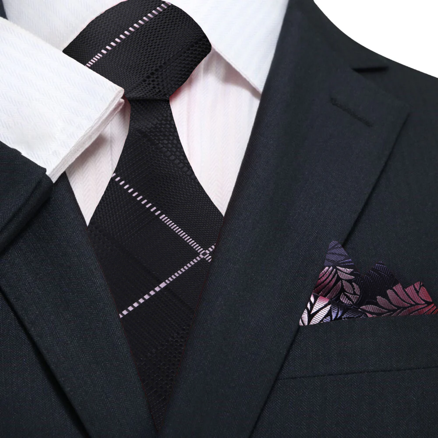 Close-up of the fabric texture of the black plaid necktie with pink accents.