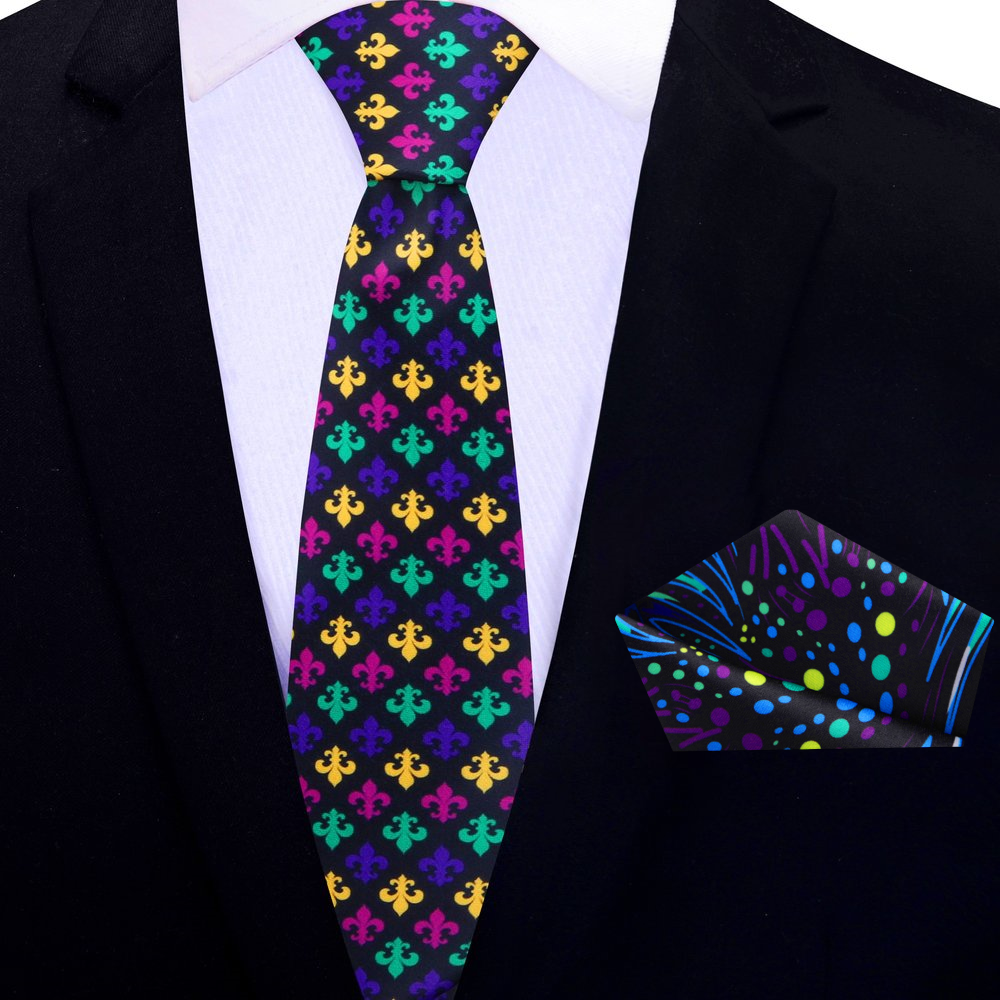 Model showcasing the Mardi Gras silk necktie paired with a dark suit, emphasizing the colorful design.