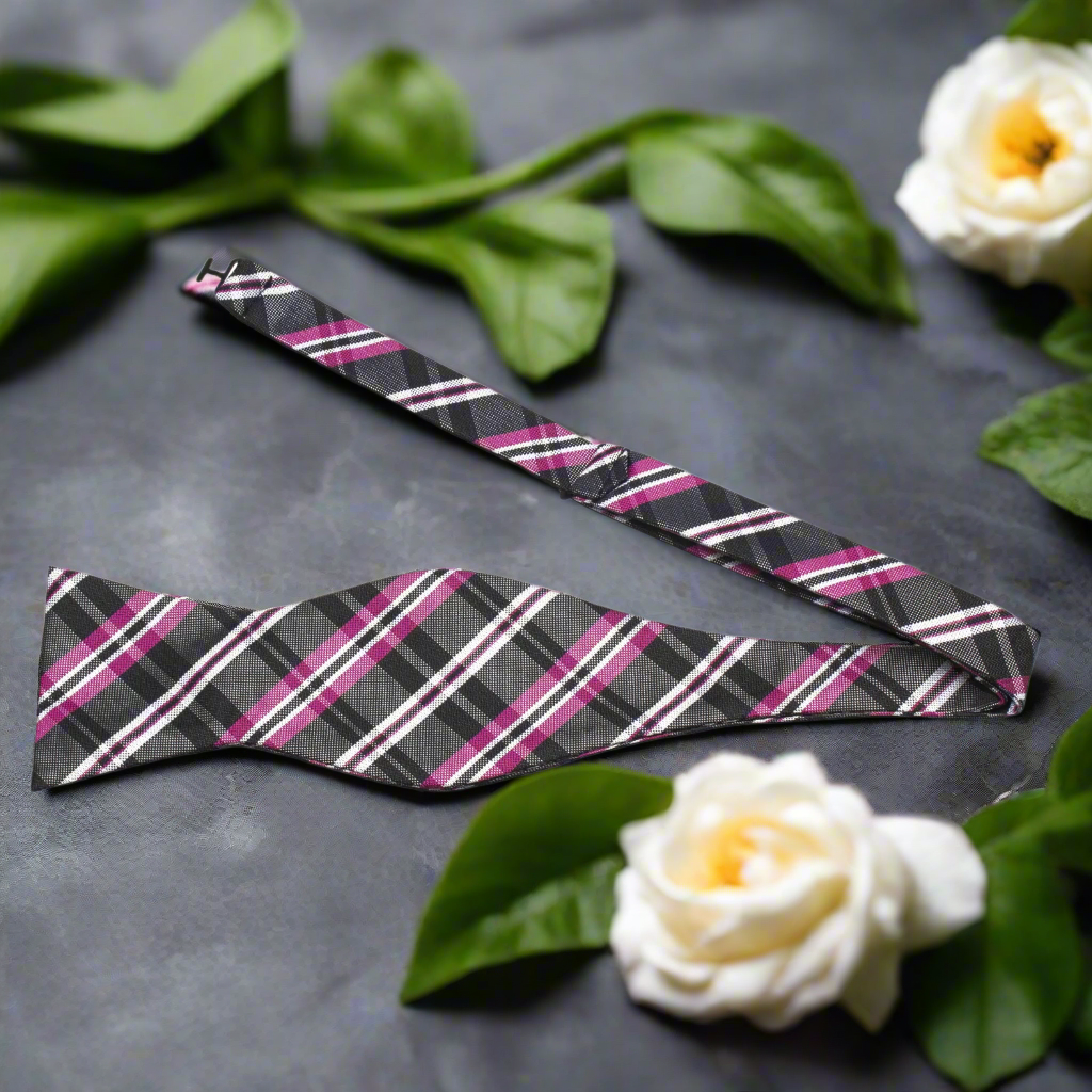 Men wearing a stylish plaid bow tie with a white dress shirt at a formal gathering