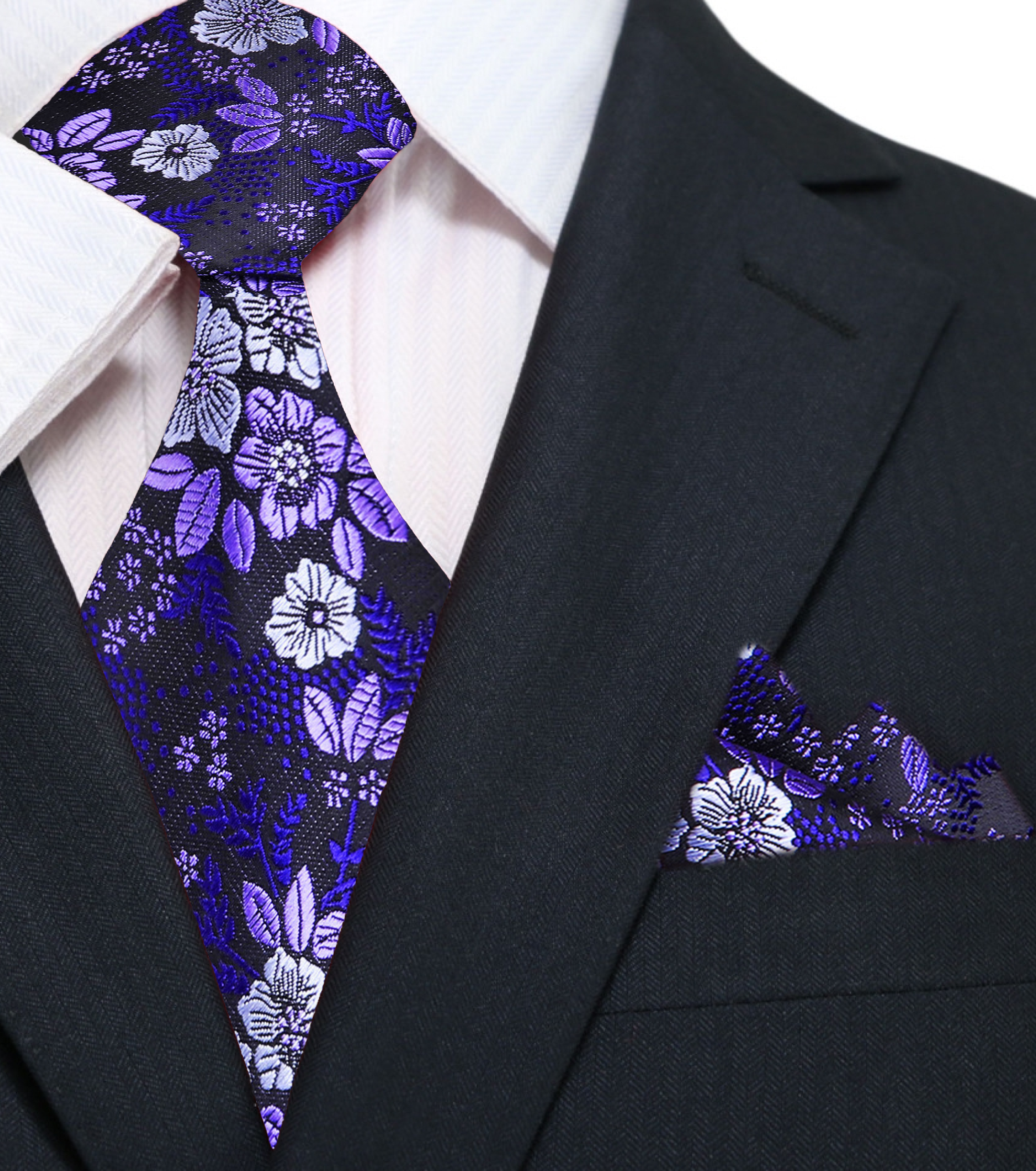 Man wearing floral necktie with a white shirt and navy suit for a wedding