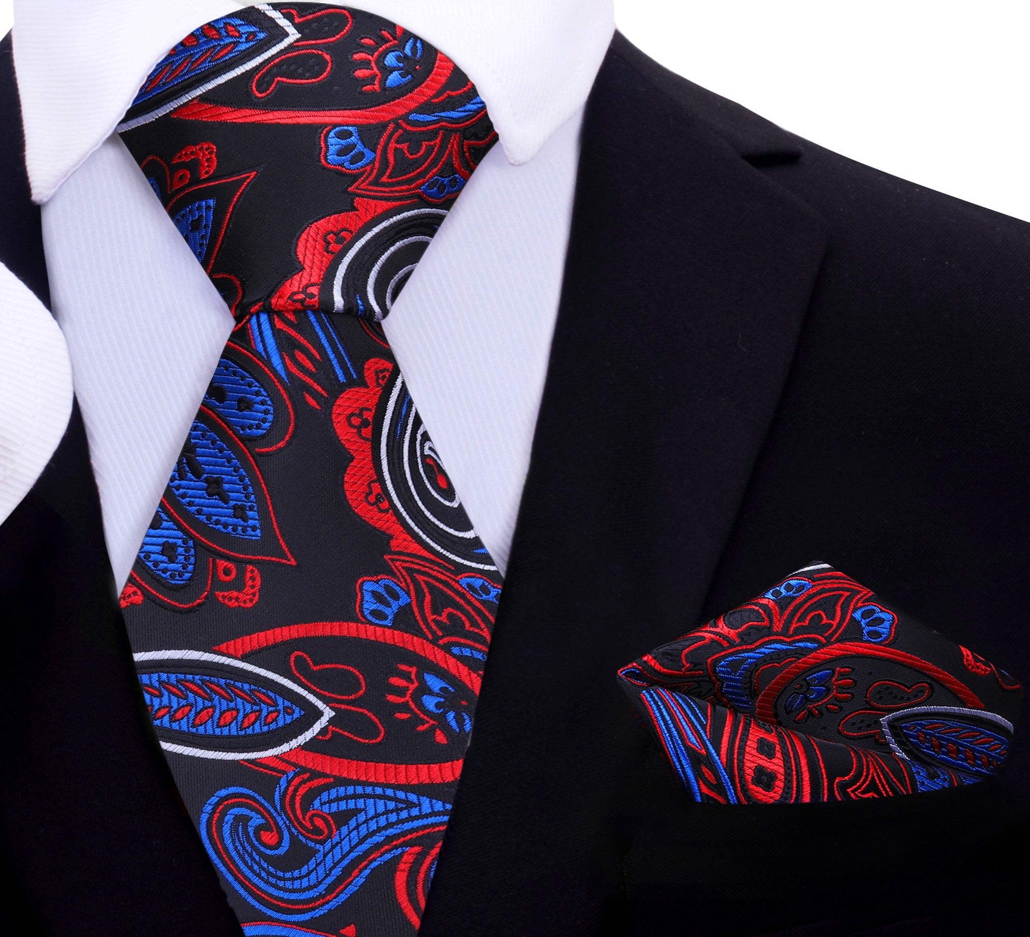 Mens stylish paisley necktie paired with a white dress shirt and navy suit