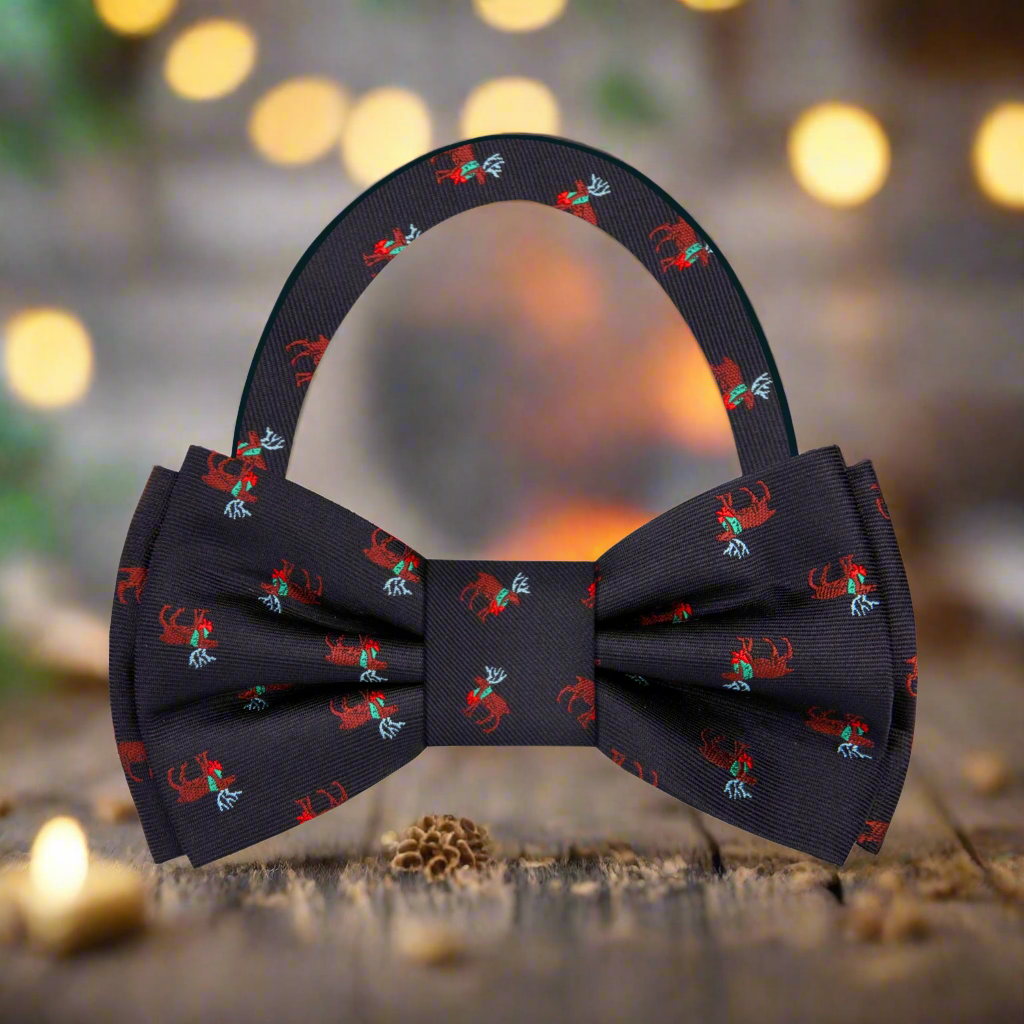Flat lay of the Christmas Reindeer Bow Tie with a matching pocket square, styled for a holiday event.