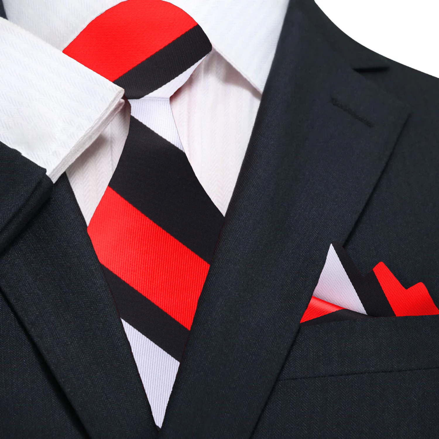 Man wearing a mens striped silk tie with a navy suit at a wedding
