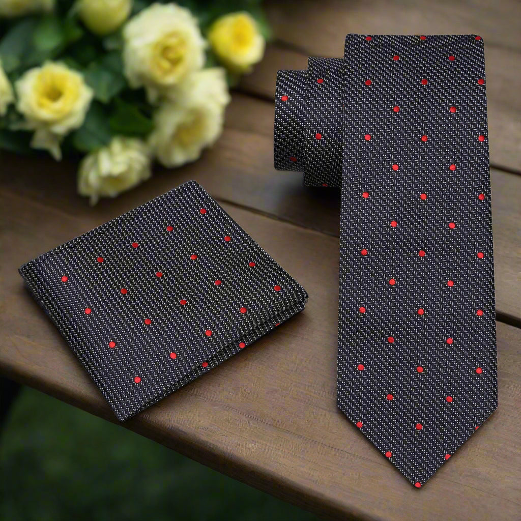 Close-up of black and white polka dot tie with subtle check texture, styled with a white dress shirt