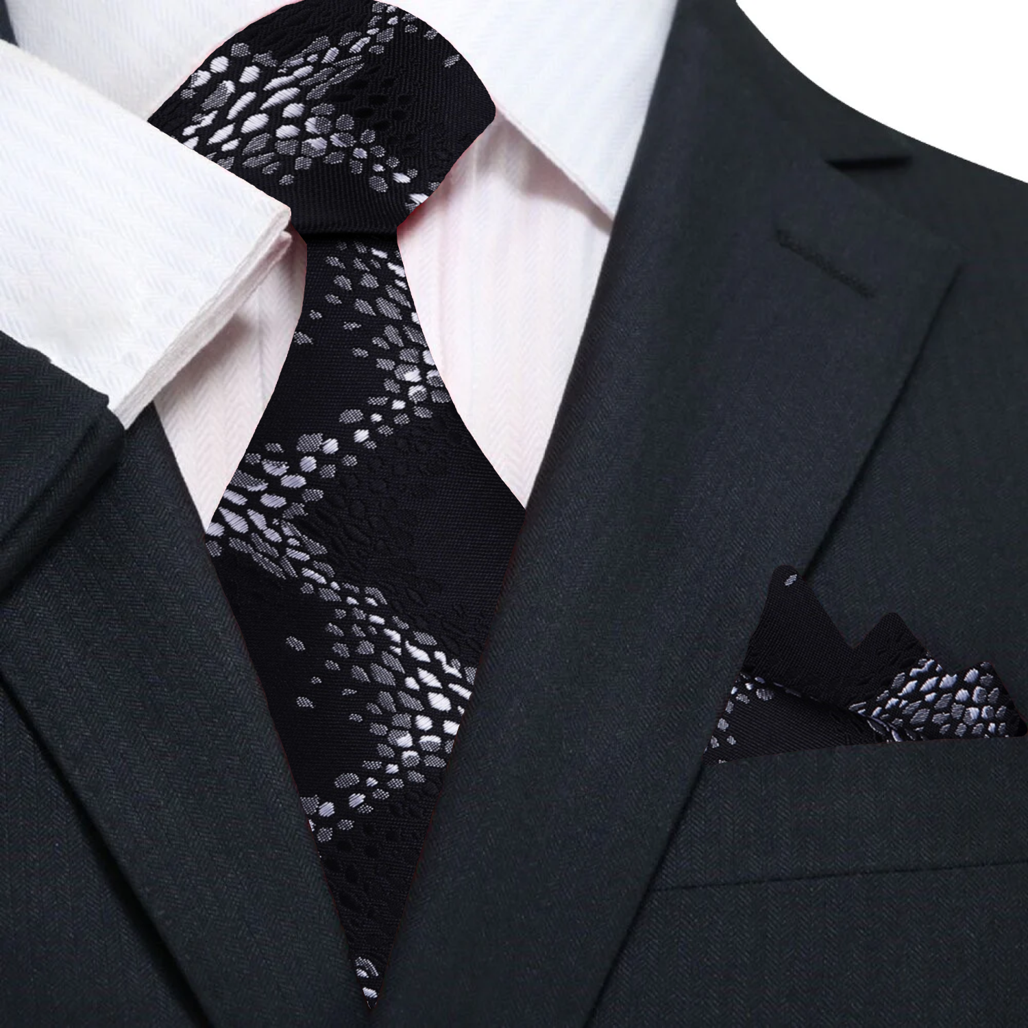 Model wearing the premium silk necktie with a cream dress shirt at a business conference.