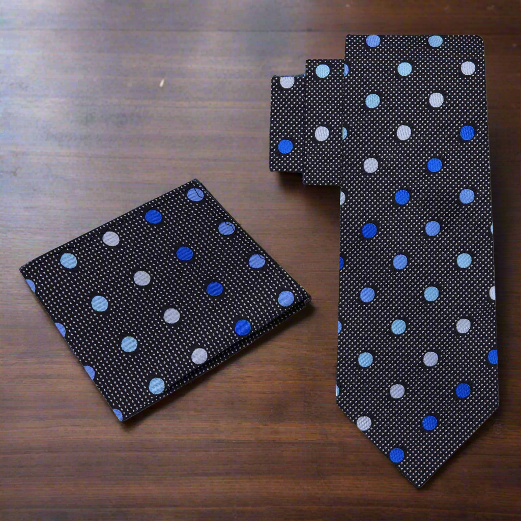 Man wearing a stylish silk necktie with a white shirt and navy suit