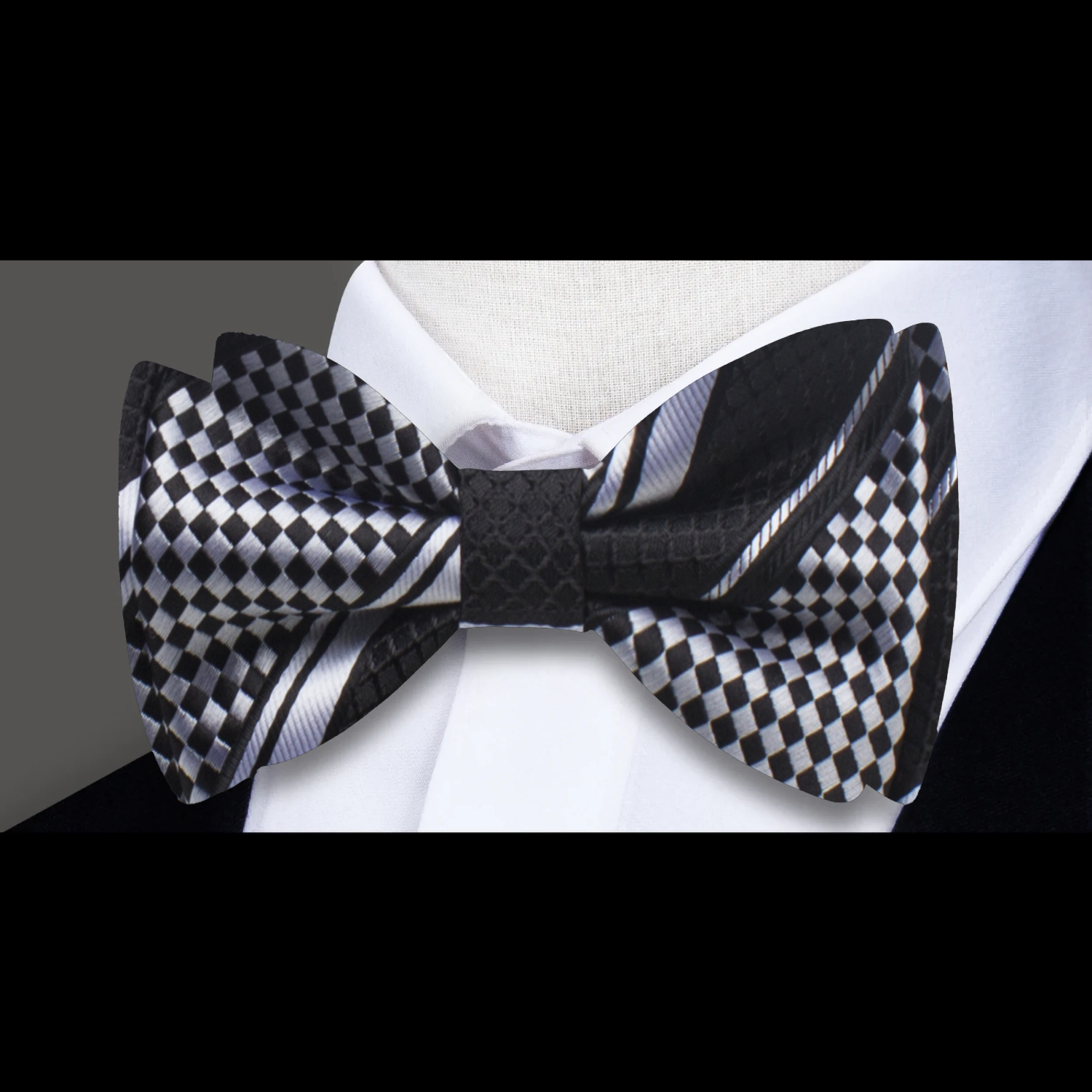 Close-up of the textured check pattern on a silk bow tie