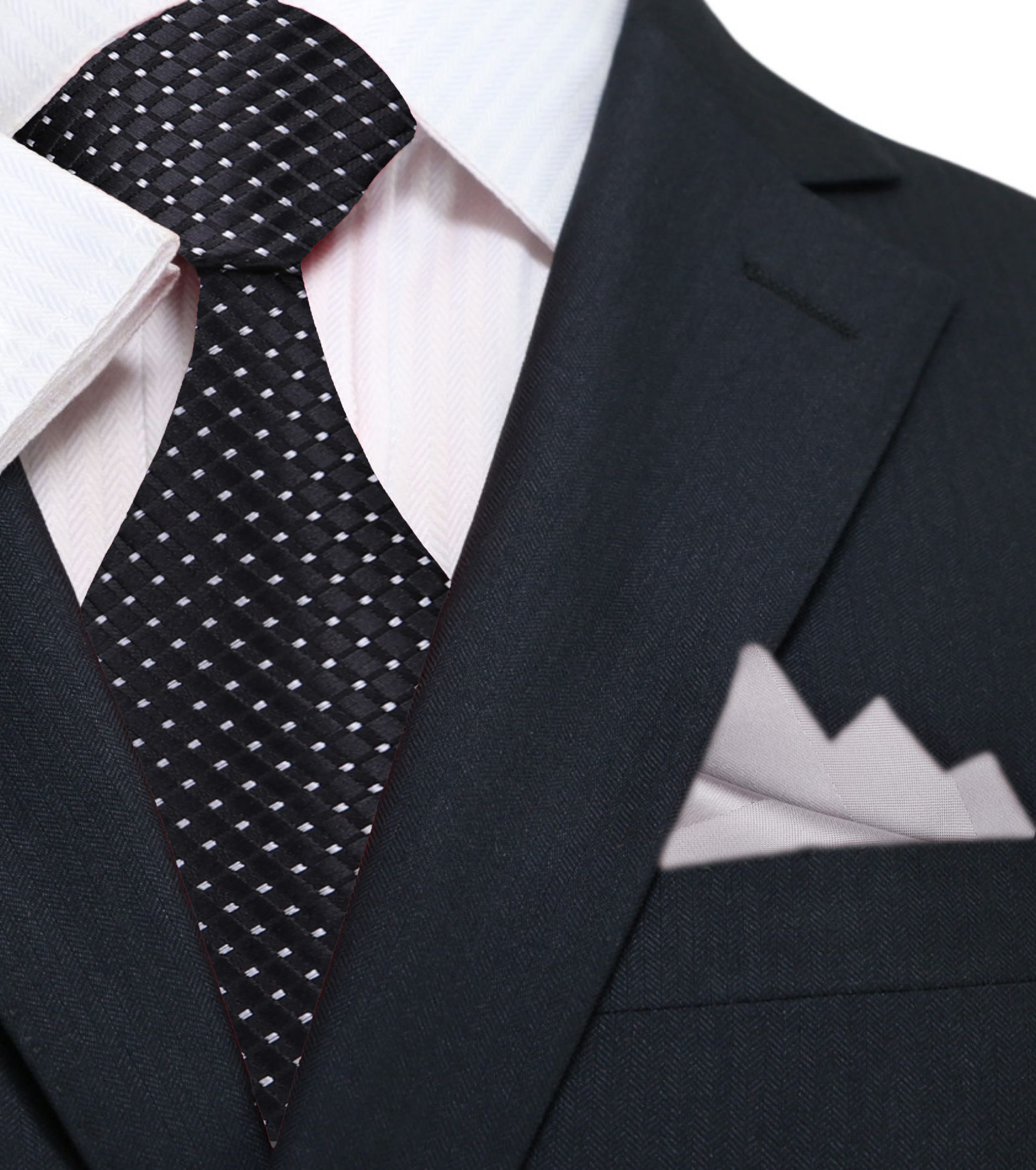 Silk tie with geometric pattern and metallic finish draped over a suit