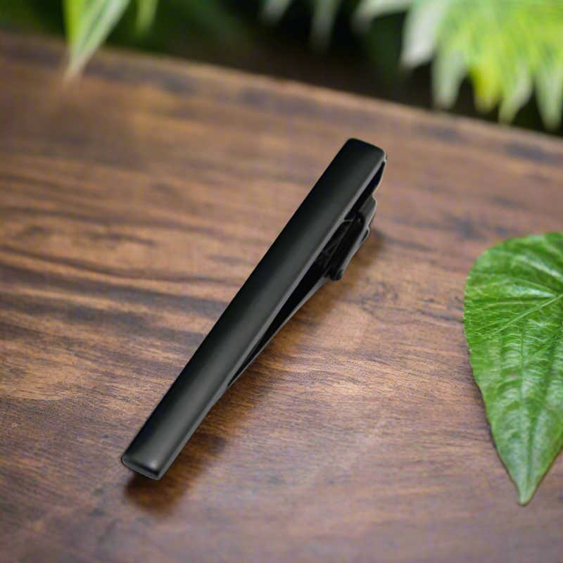 Solid tie bar in black chrome finish styled on grey formal suit