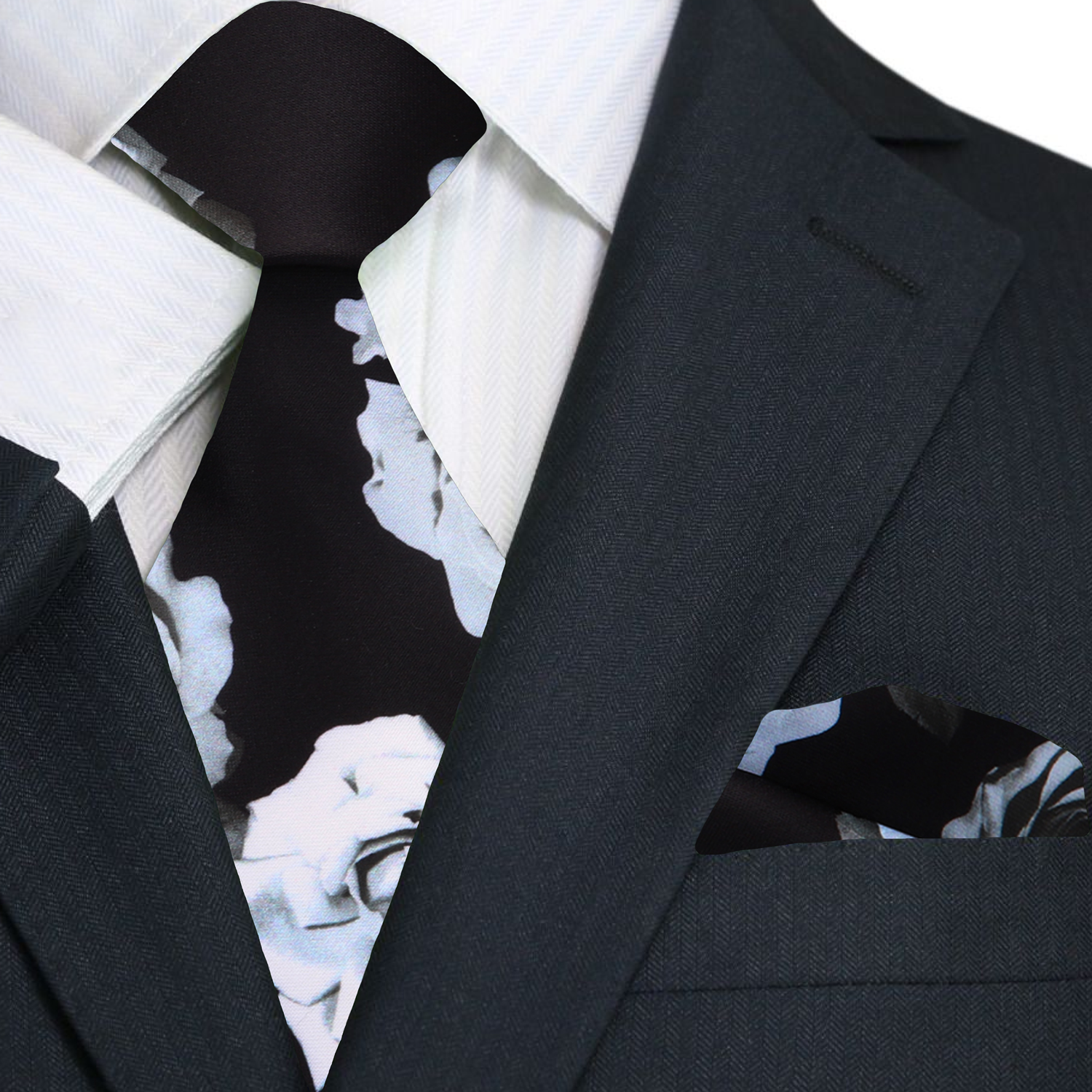 Close-up of the floral print necktie, highlighting the vibrant pink roses against a rainy day gray background.