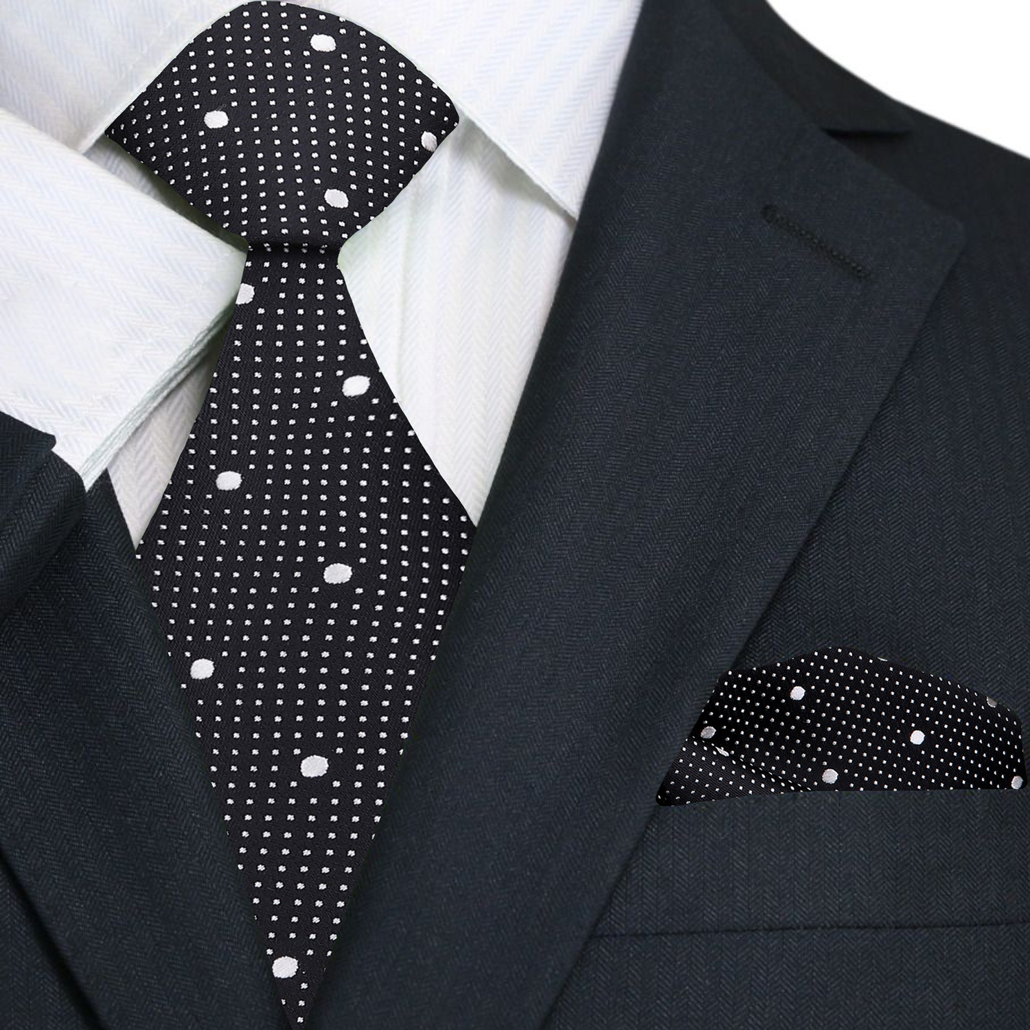 Full view of Blackwood polka dot tie and matching pocket square set laid flat on a charcoal suit