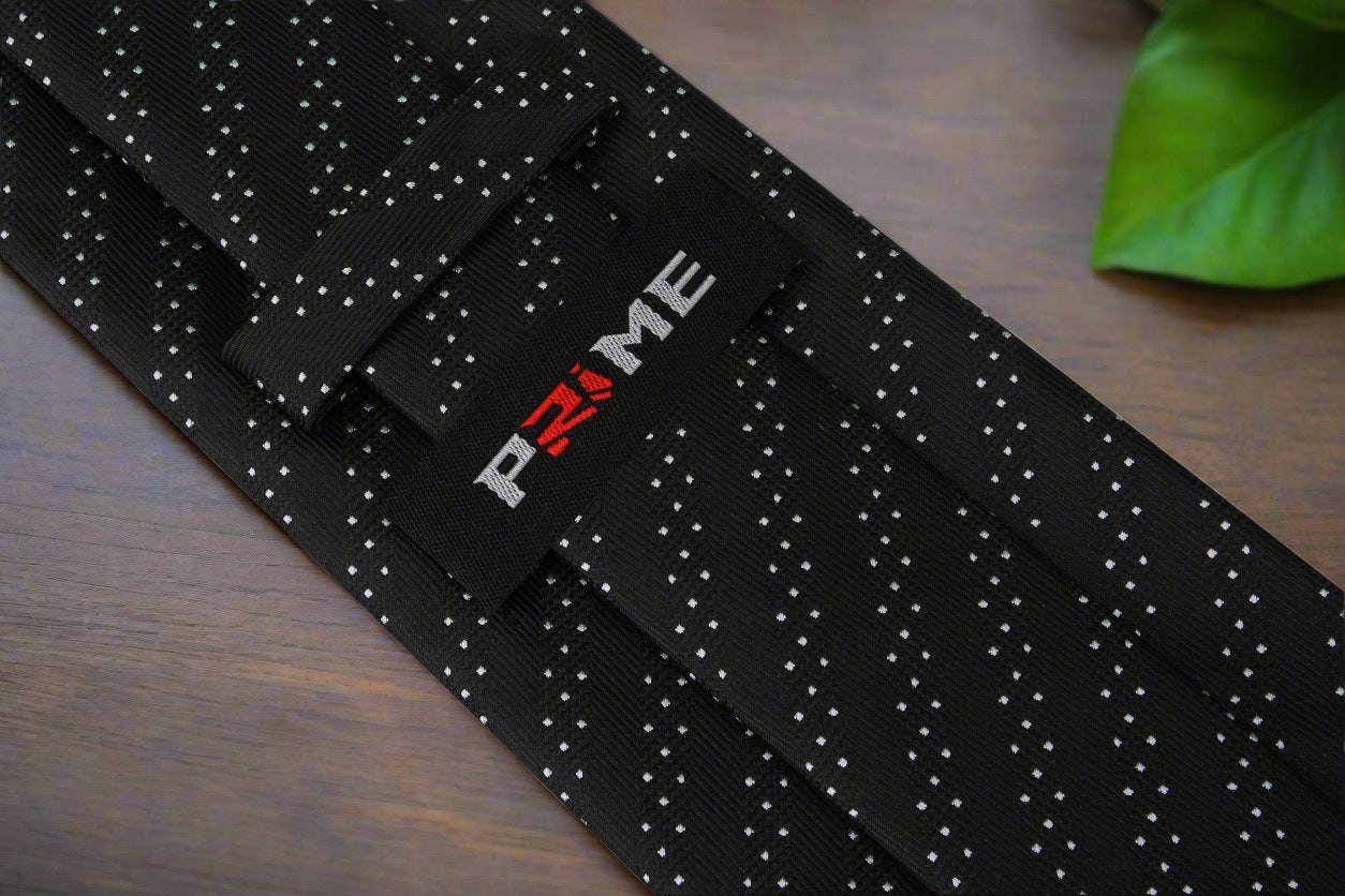 Man wearing stylish black tie with white dots at wedding reception