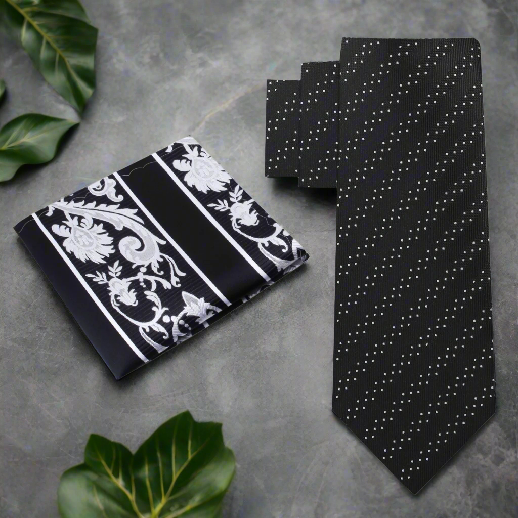 Close-up of black silk necktie with white dots and stripes for formal wear