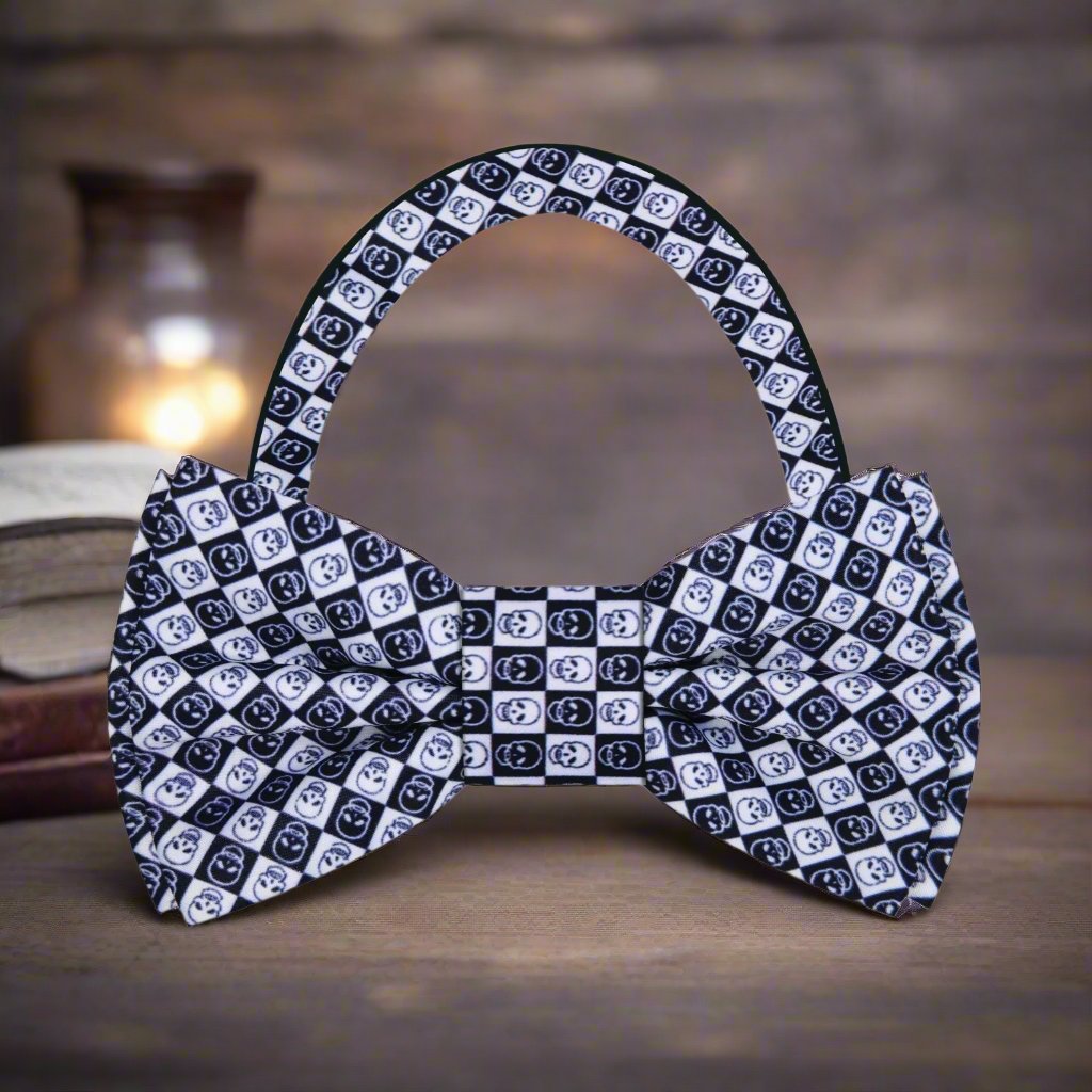 Blue skull geometric bow tie displayed on a crisp white dress shirt, showcasing its unique pattern.