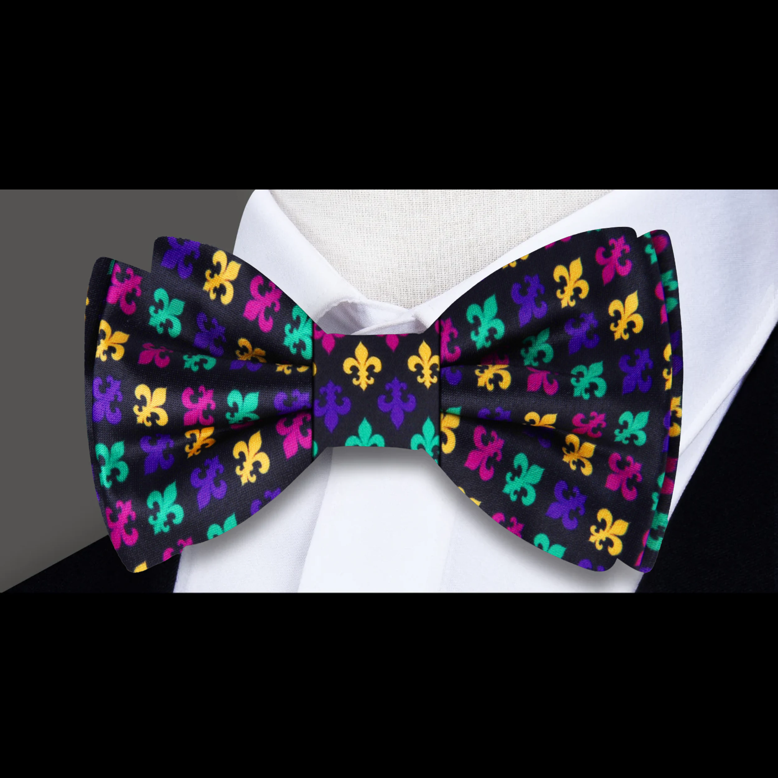 Stylish gentleman wearing a Fleur-de-Lis Silk Bow Tie at a formal event.