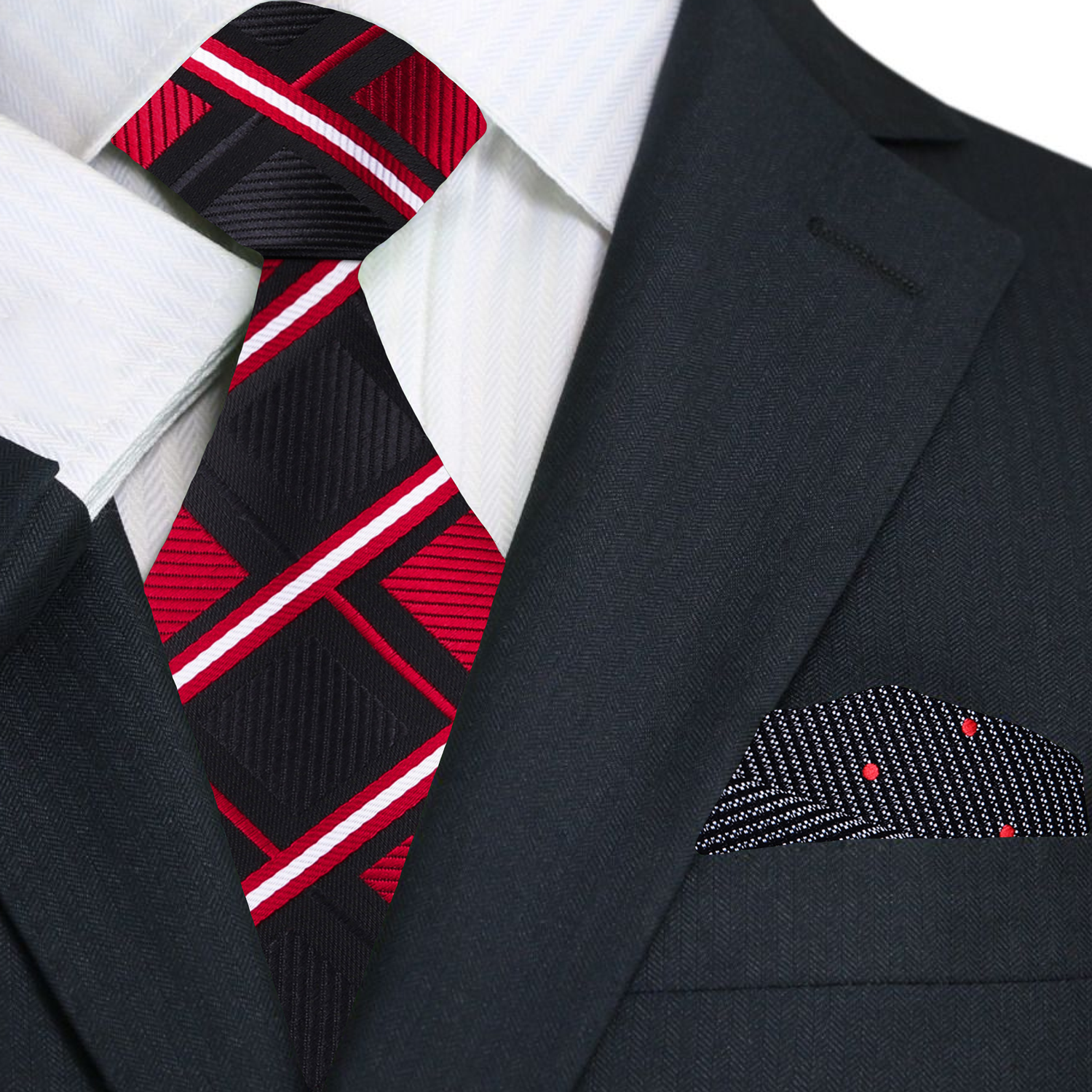Styled shot of a man wearing a black and red geometric pattern necktie with a navy suit