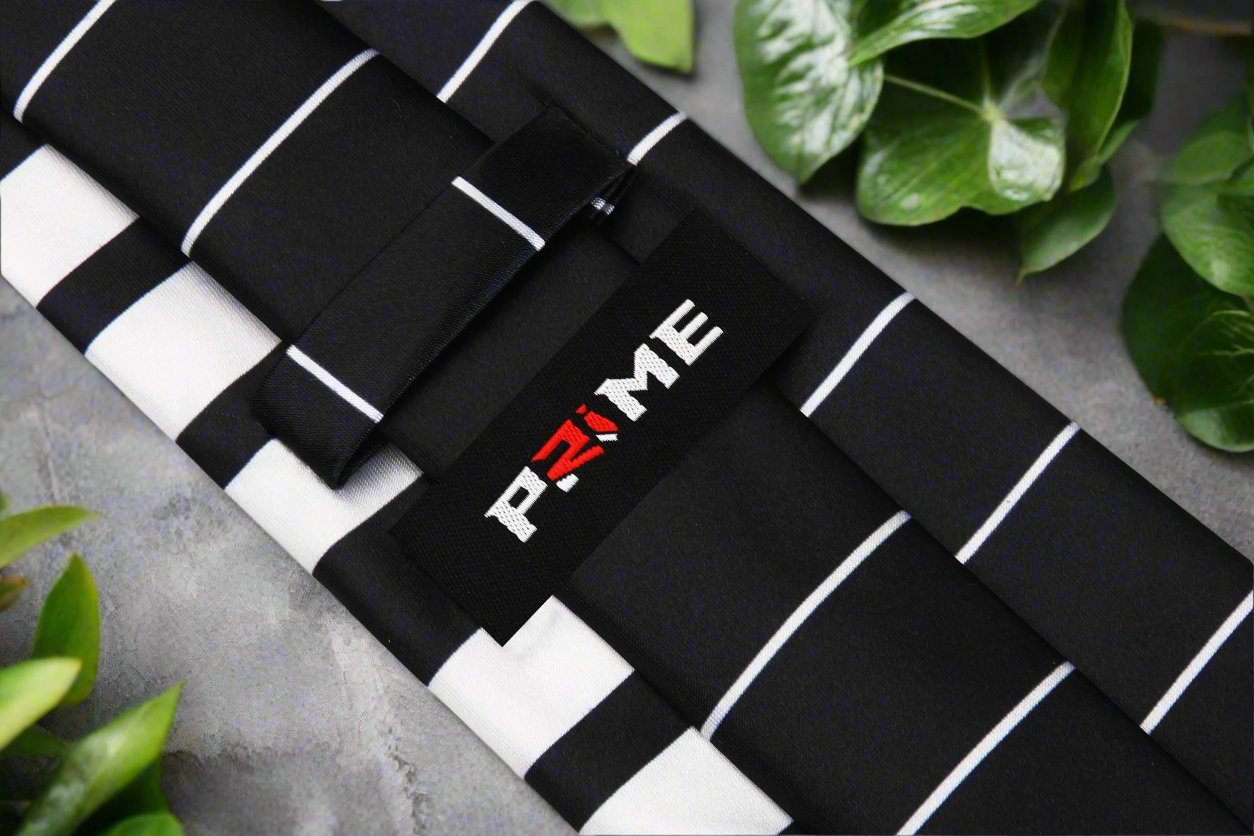 Close-up of black and white piano tie with silk sheen, perfect for formal music events