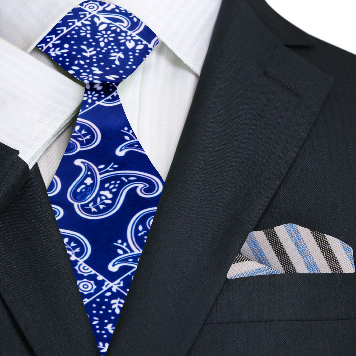 Close-up of navy paisley necktie draped over a light gray dress shirt, highlighting the contrast.