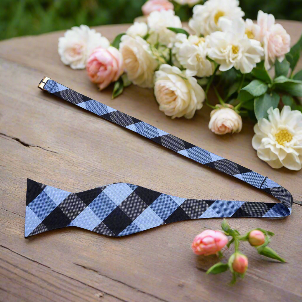 Close-up of a stylish mens plaid bow tie with a self-tie knot, perfect for weddings