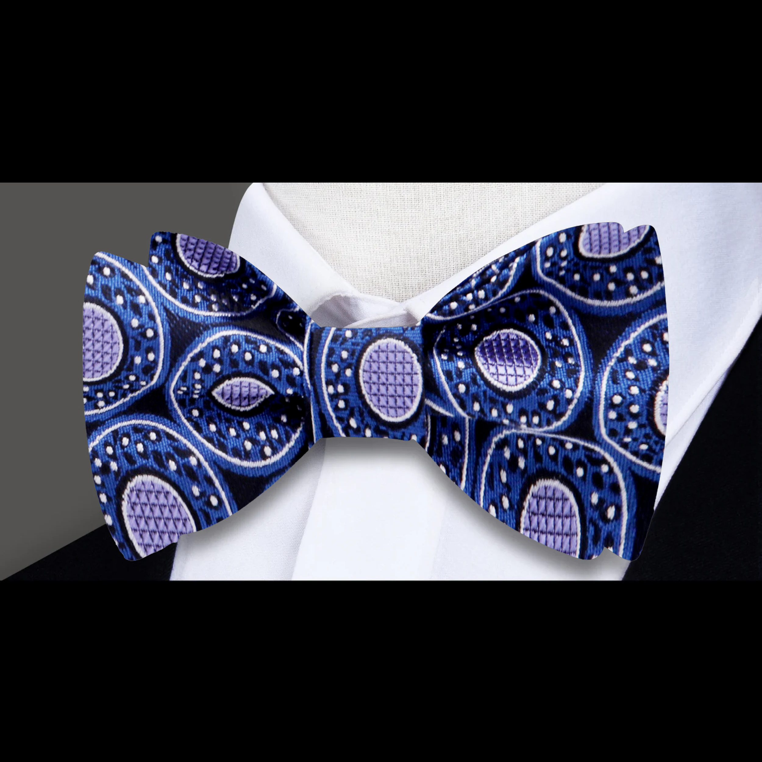 Man wearing the Donut Bow Tie at a wedding, styled with a light purple shirt, radiating a fun yet sophisticated look.