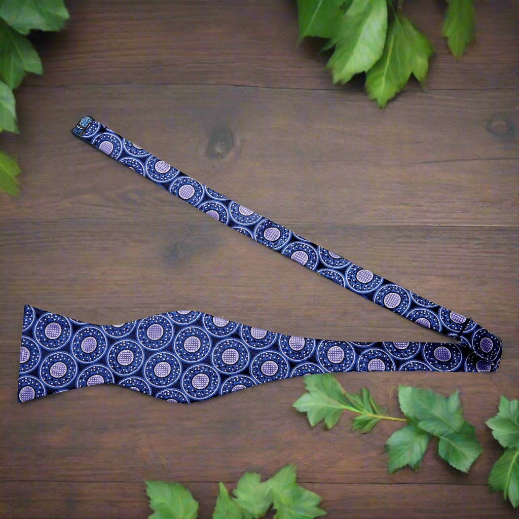 Whimsical Donut Sprinkles Silk Bow Tie displayed on a tailored suit, highlighting the playful design.