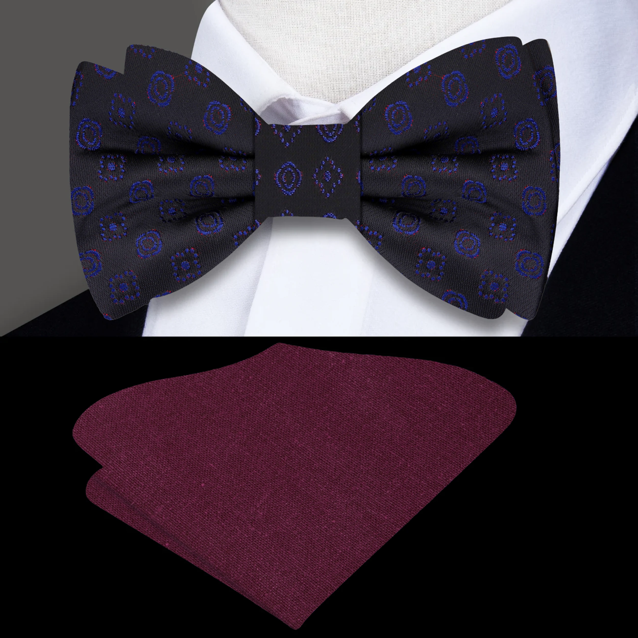 Luxury silk bow tie styled with a crisp white dress shirt and navy blue suit.