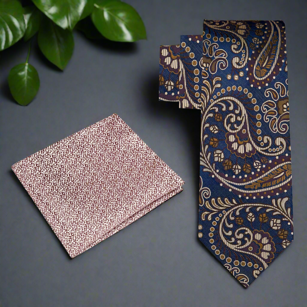 Close-up of the detailed paisley pattern on the dark blue and brown necktie