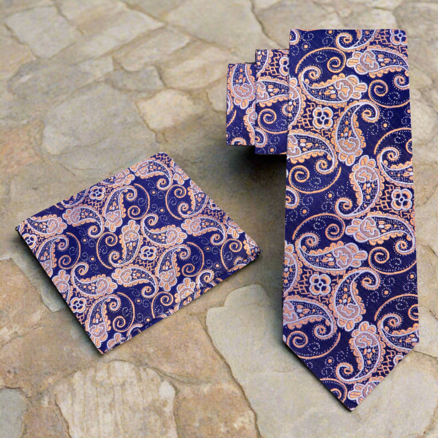 Man wearing a paisley silk tie with a navy suit at a wedding