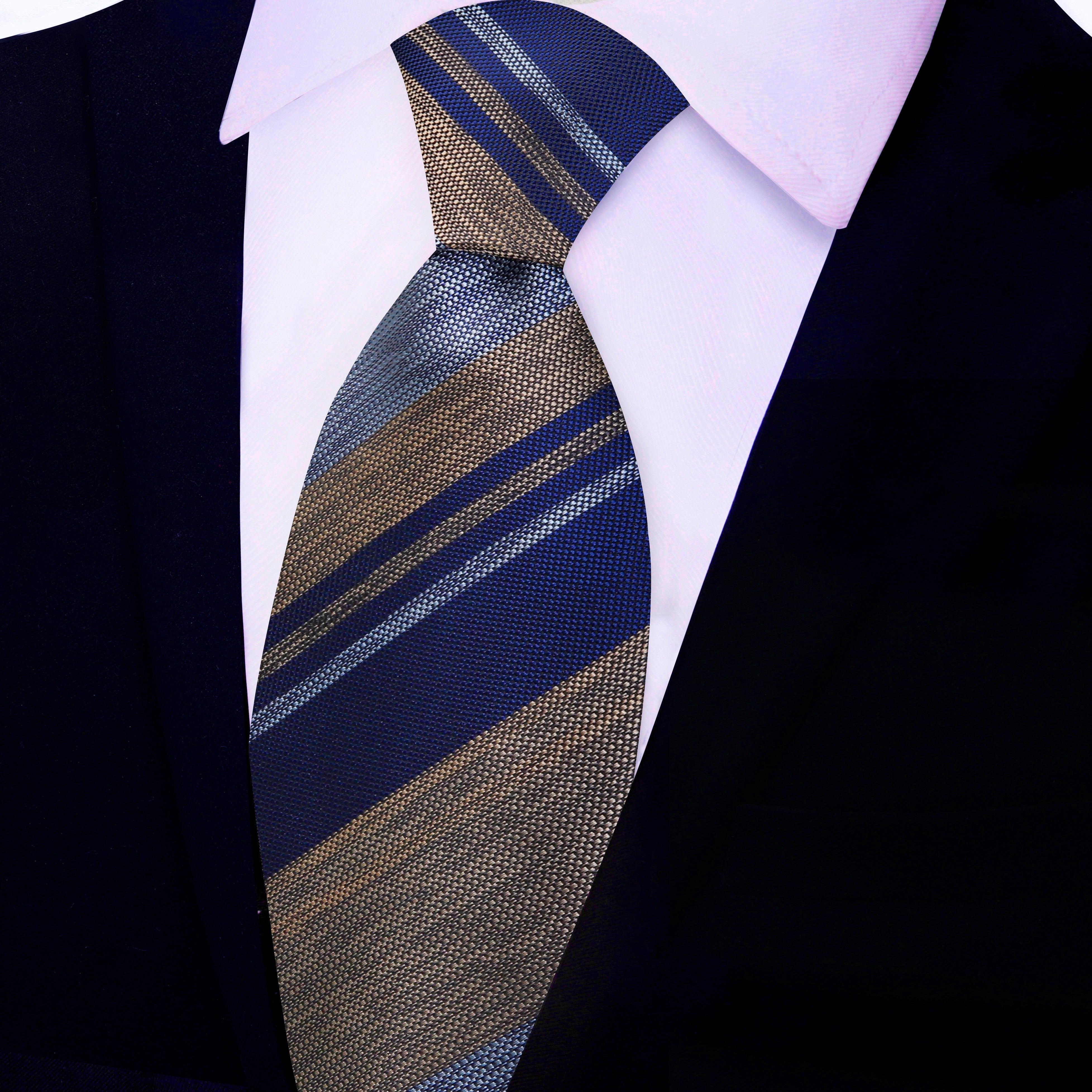 Styled silk necktie paired with a medium grey suit, suitable for client presentations.