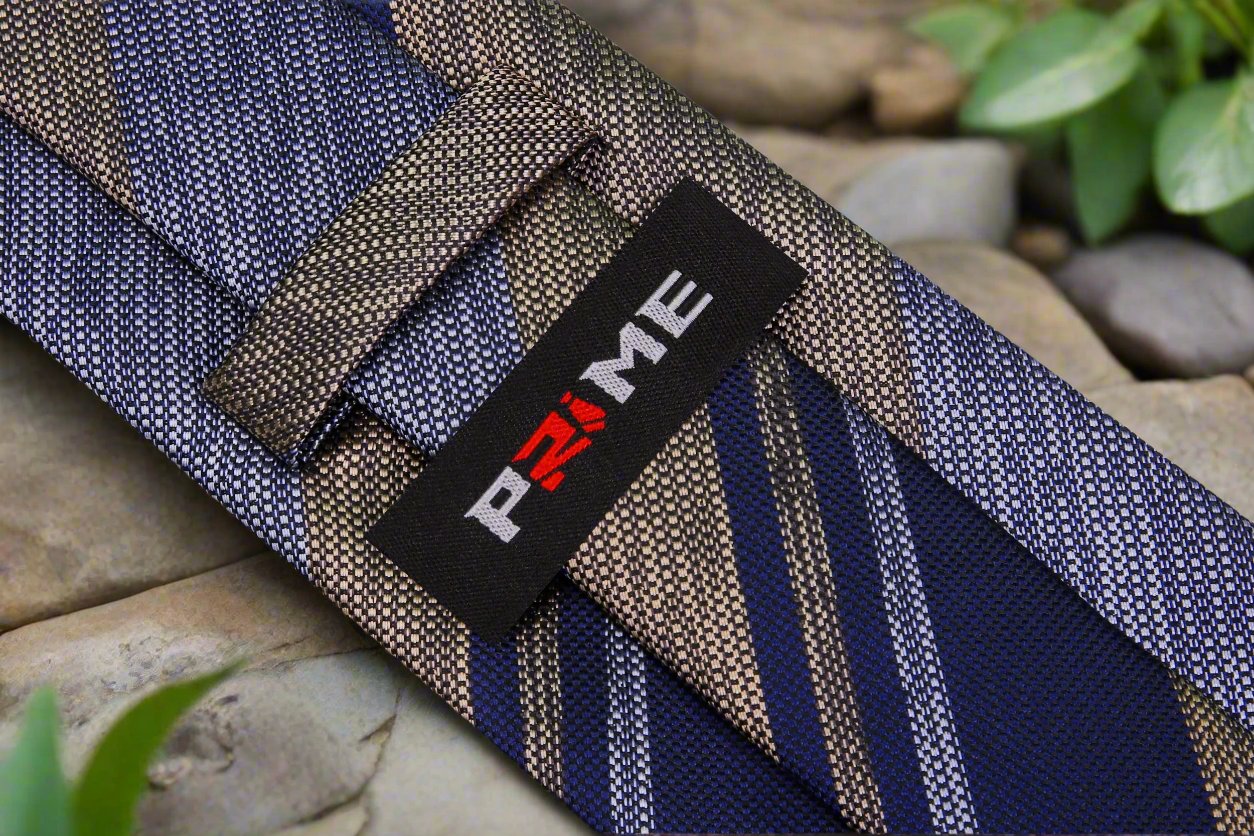 Styled silk necktie paired with a medium grey suit, suitable for client presentations.