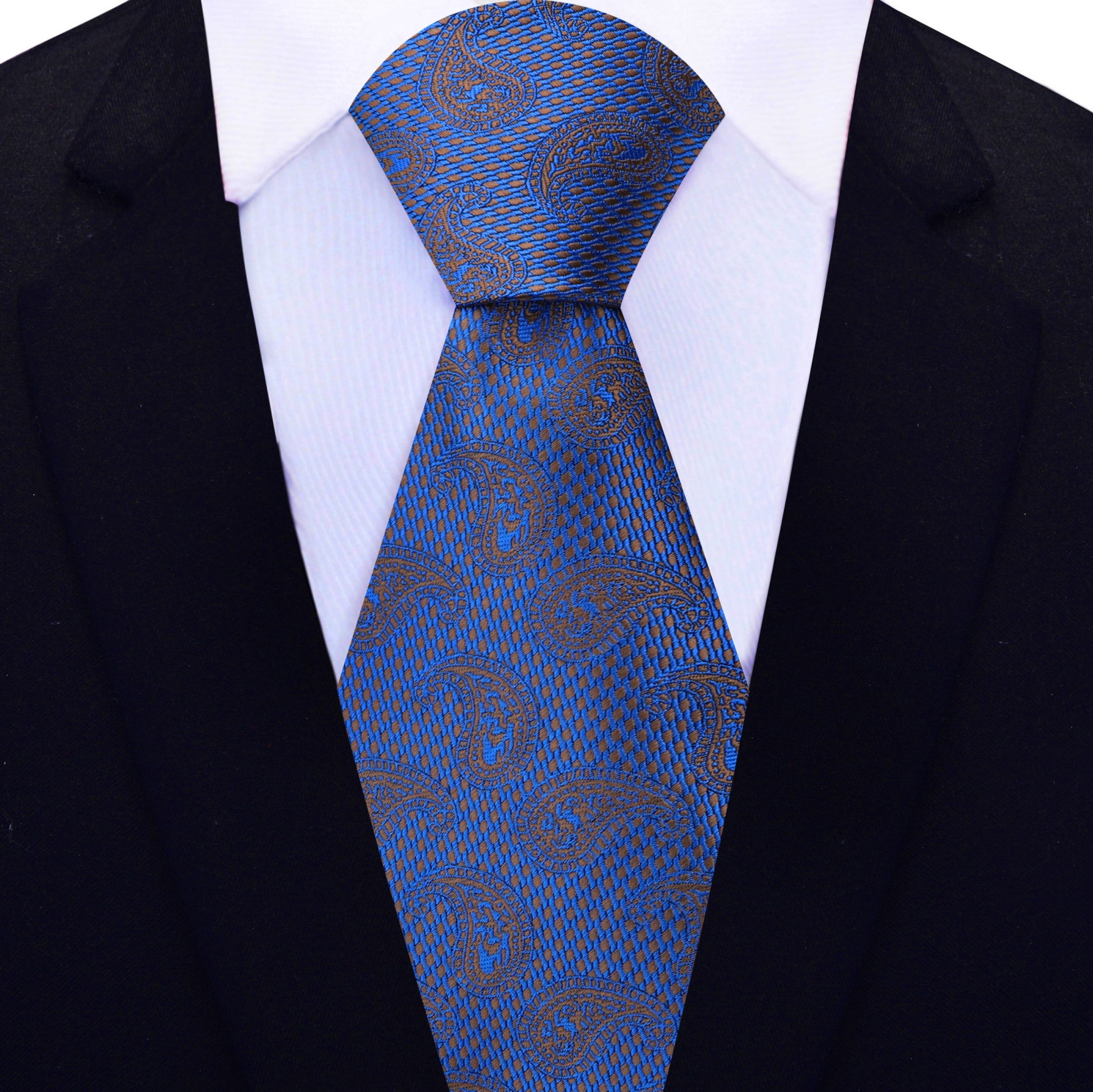 Elegant dark blue paisley silk tie displayed on a formal shirt and suit, showcasing its rich colors and patterns.