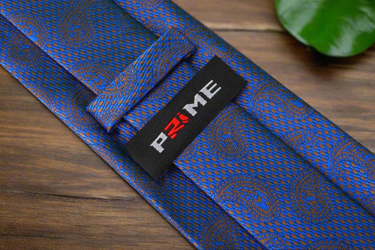 Elegant dark blue paisley silk tie styled with a light blue shirt, showing how it complements various outfits.