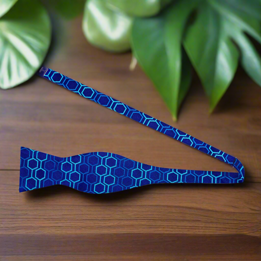 Self-tie bow tie in vibrant blue, perfectly styled with a crisp white shirt.
