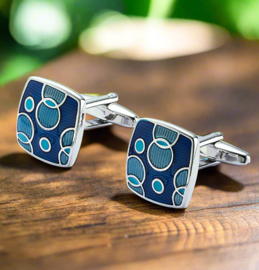 Elegant blue circle cufflinks showcasing a modern design from a top view.