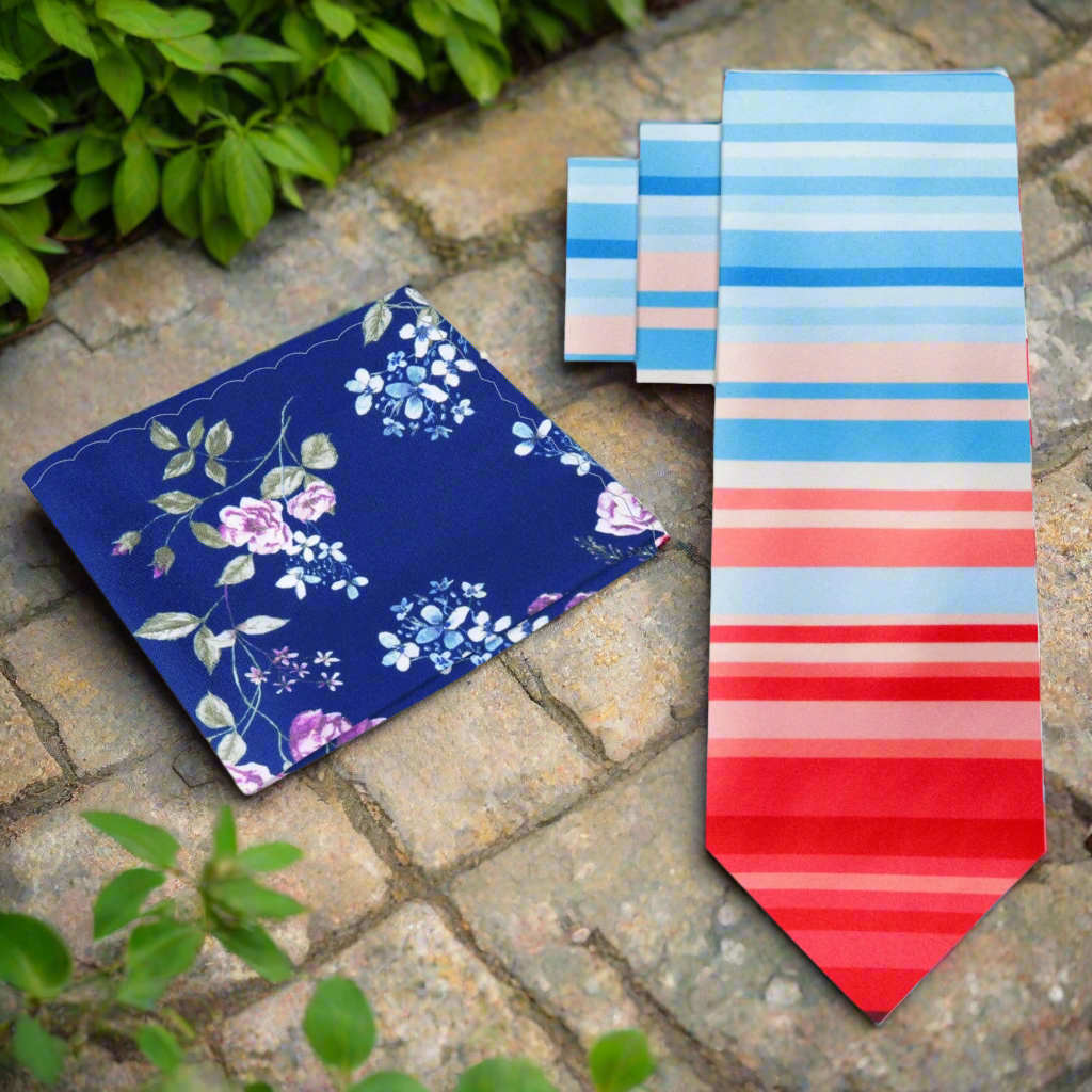 Mens silk necktie with gradient stripe pattern in red and blue, styled with a matching pocket square