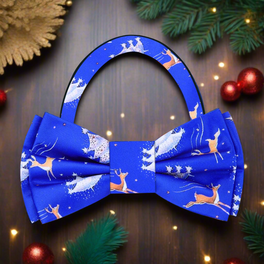 Close-up of festive silk bow tie with reindeer and Christmas trees, suitable for holiday events