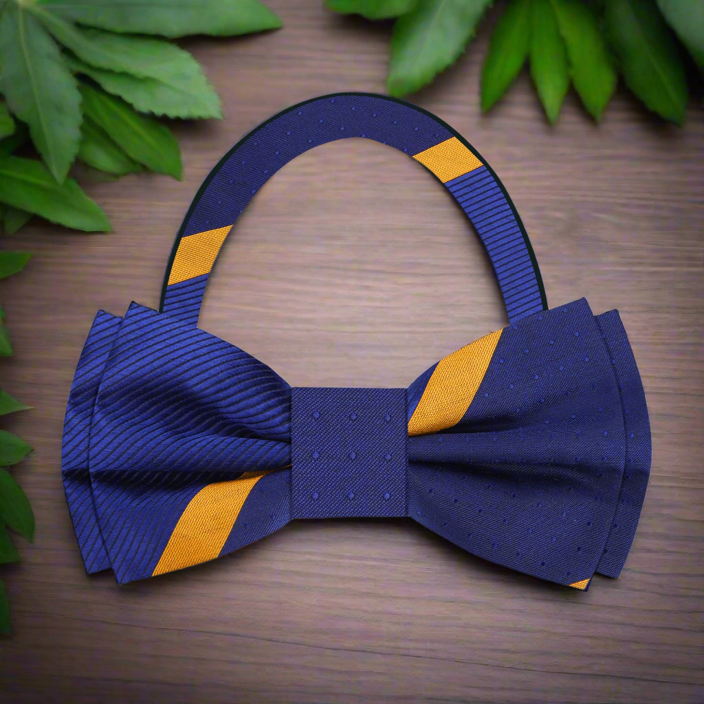 Styling of the dark blue striped bow tie with a classic white dress shirt and charcoal suit, perfect for formal occasions.