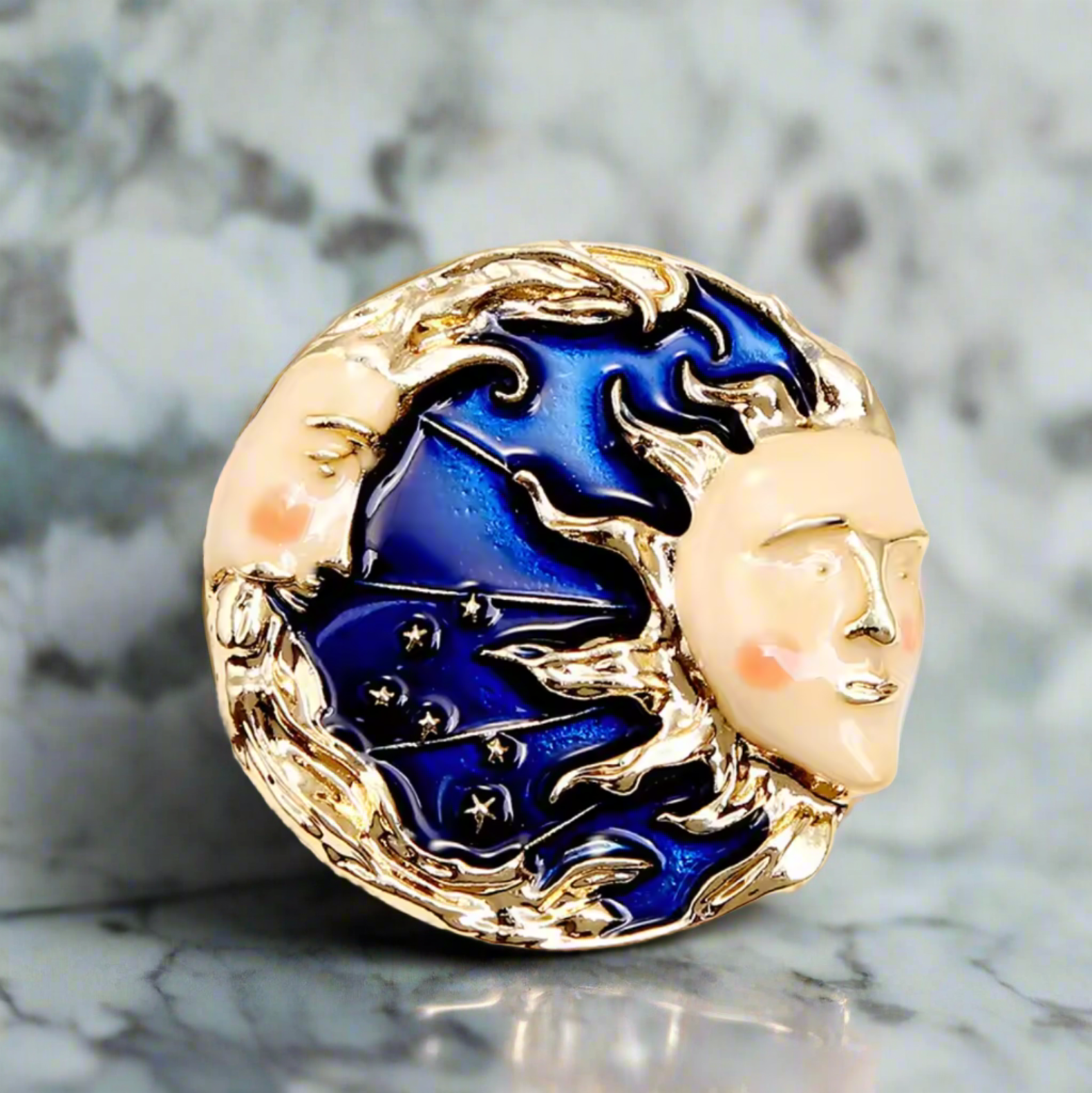 Celestial Harmony lapel pin showcasing the moon and sun design.