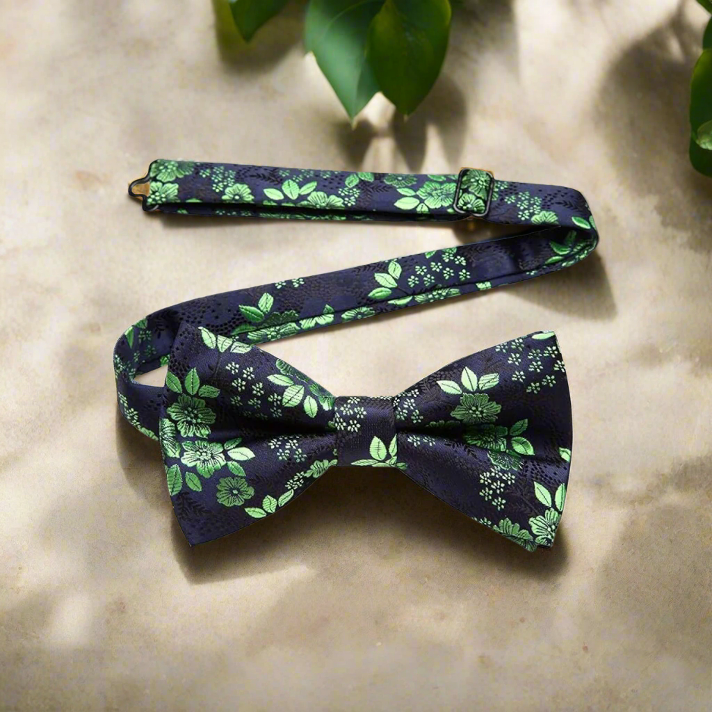 Elegant floral bow tie paired with a light grey suit, showcasing a fresh and versatile look.