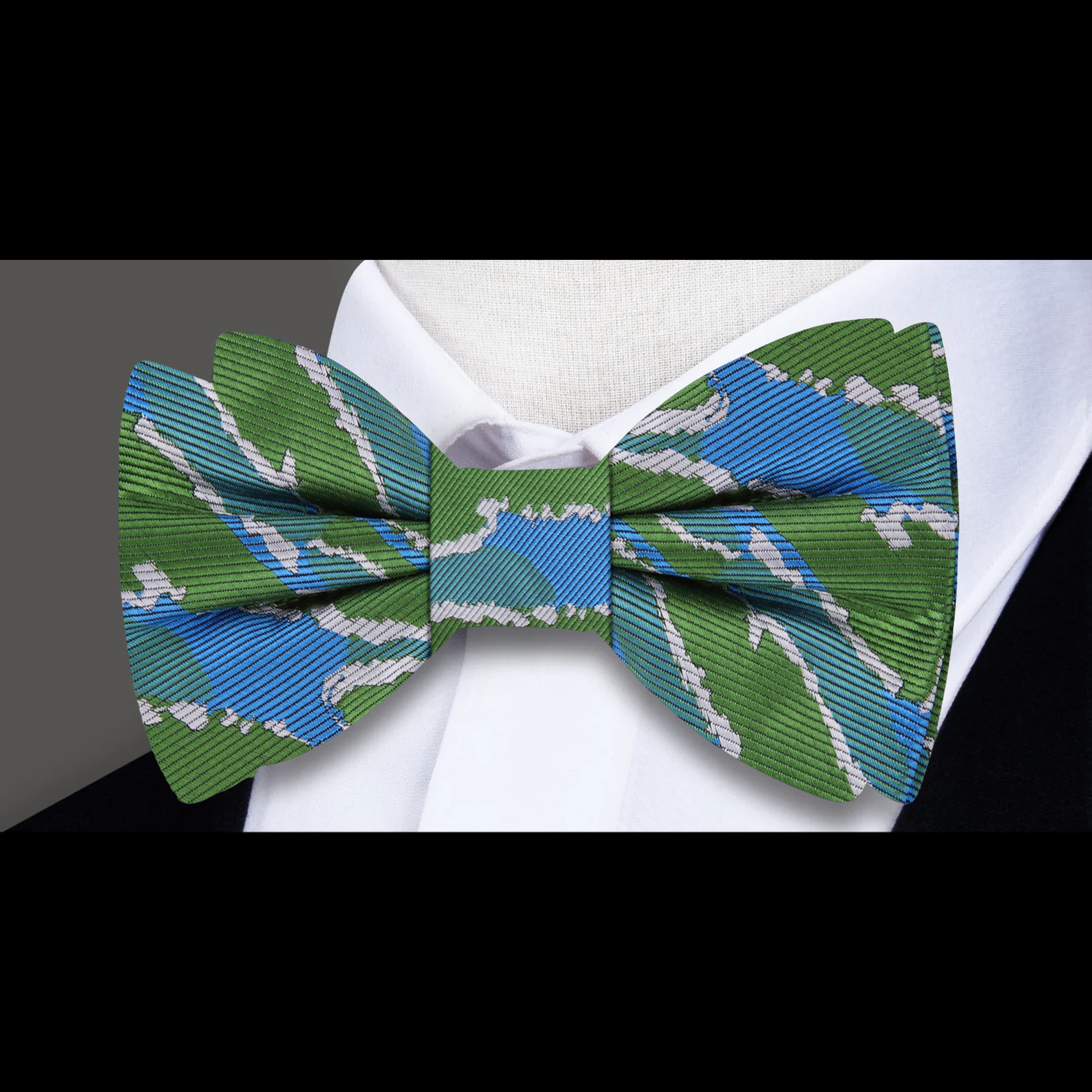 Model wearing the silk bow tie with matching shirt, showcasing versatile style