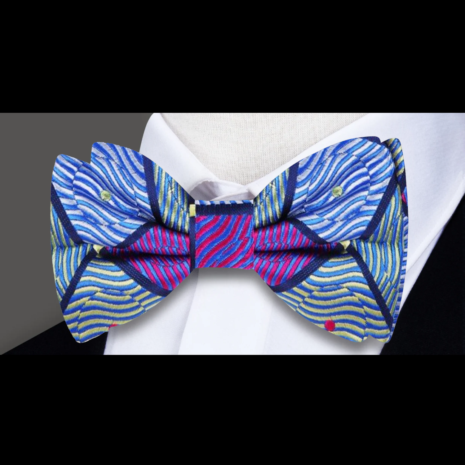 Elegant geometric silk bow tie showcasing intricate patterns in green, blue, and purple, perfect for formal events.