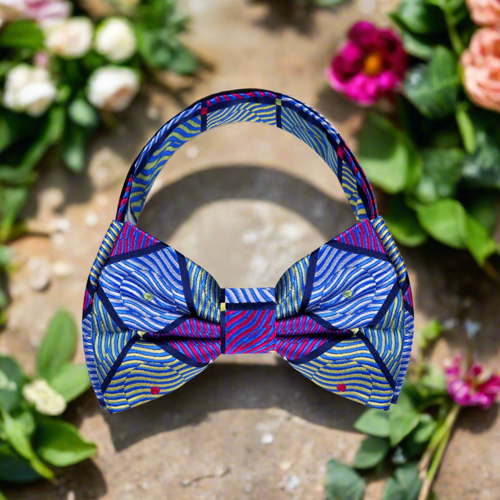 Elegant geometric silk bow tie showcasing intricate patterns in green, blue, and purple, perfect for formal events.