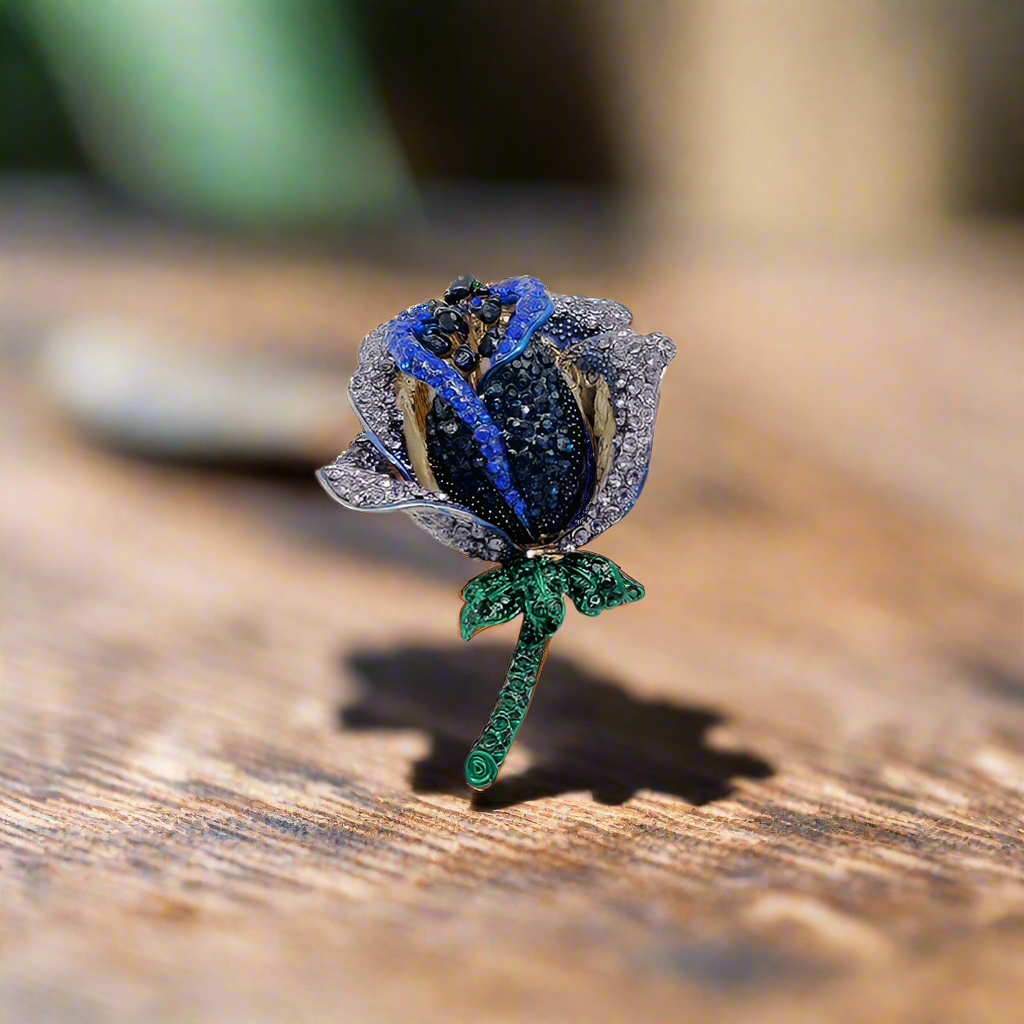 Stylish rose pin against a light blue dress shirt, showcasing modern elegance.